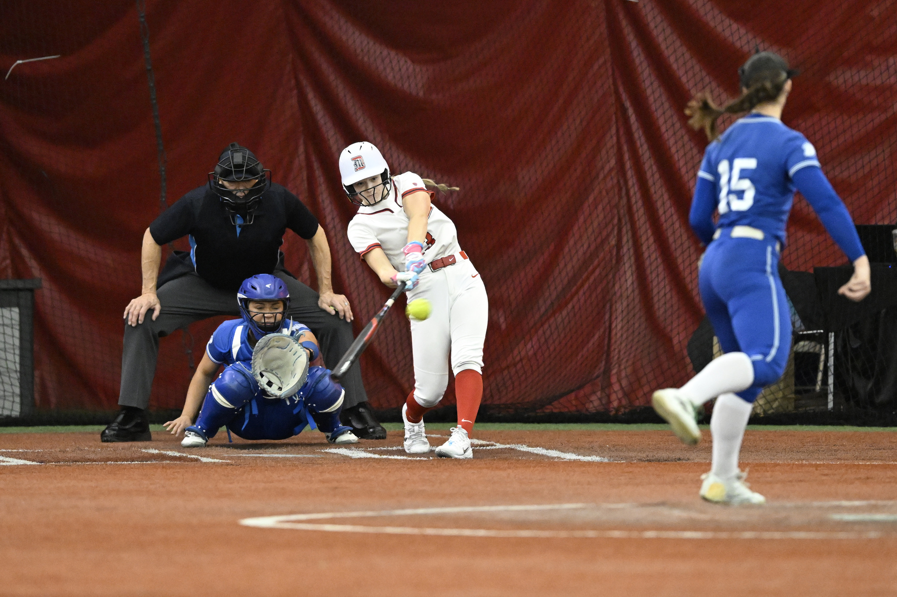 Detroit Mercy second baseman Wendy Ketola (23) hits the game winning RBI against Drake University, Friday, February 6, 2025, at The Dome at the Parkway Bank Sports Complex in Rosemont, IL.