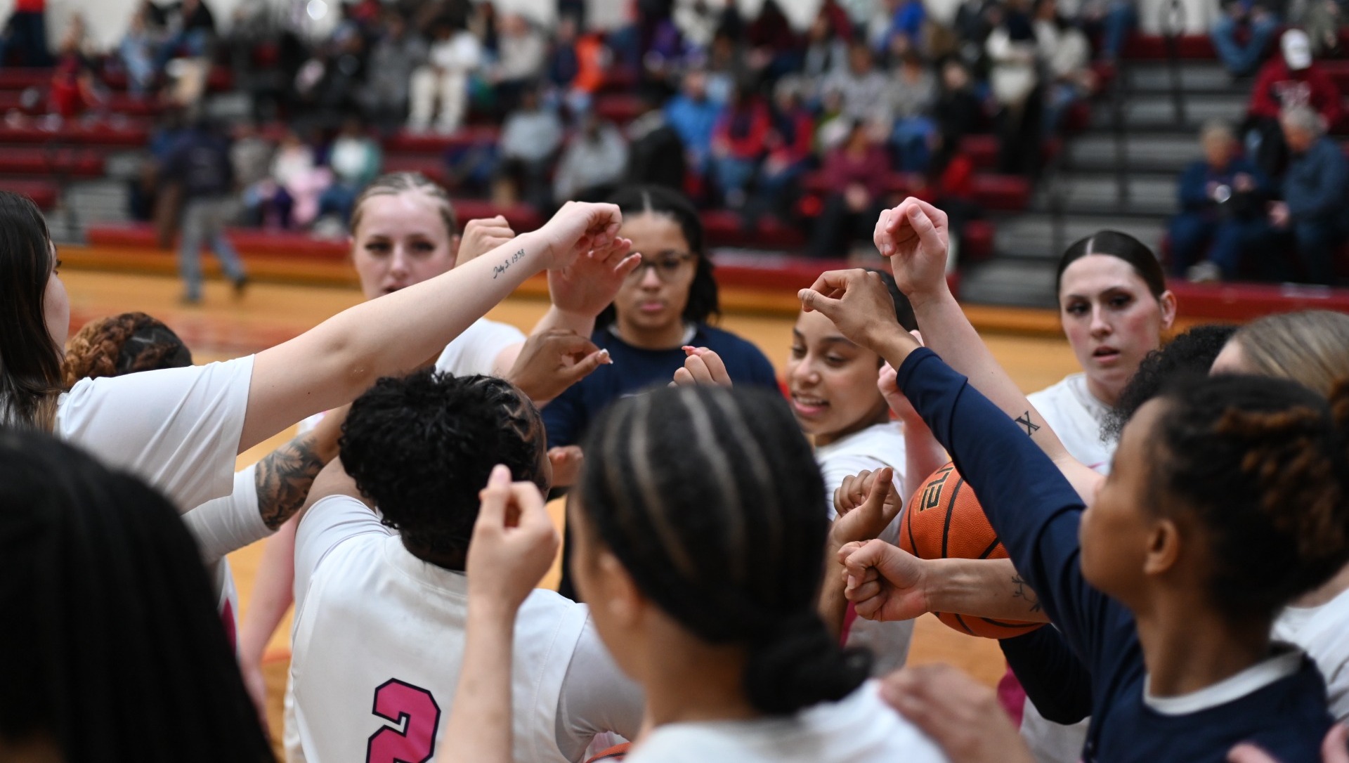 Team huddle pre-game before senior day vs NKU