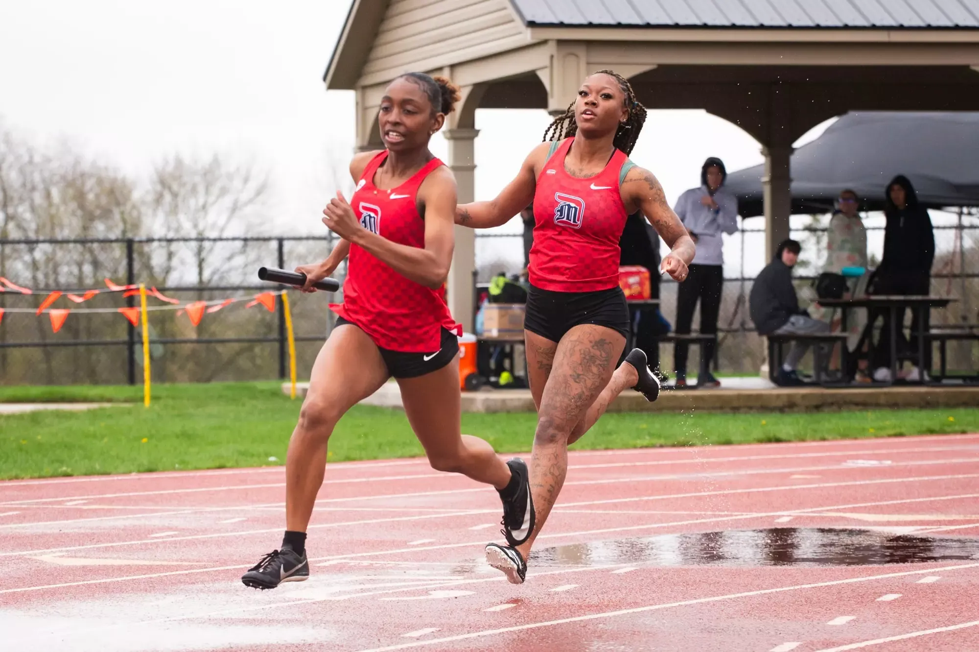 Kynnedi Patterson gets the baton from Kaliyah Favors