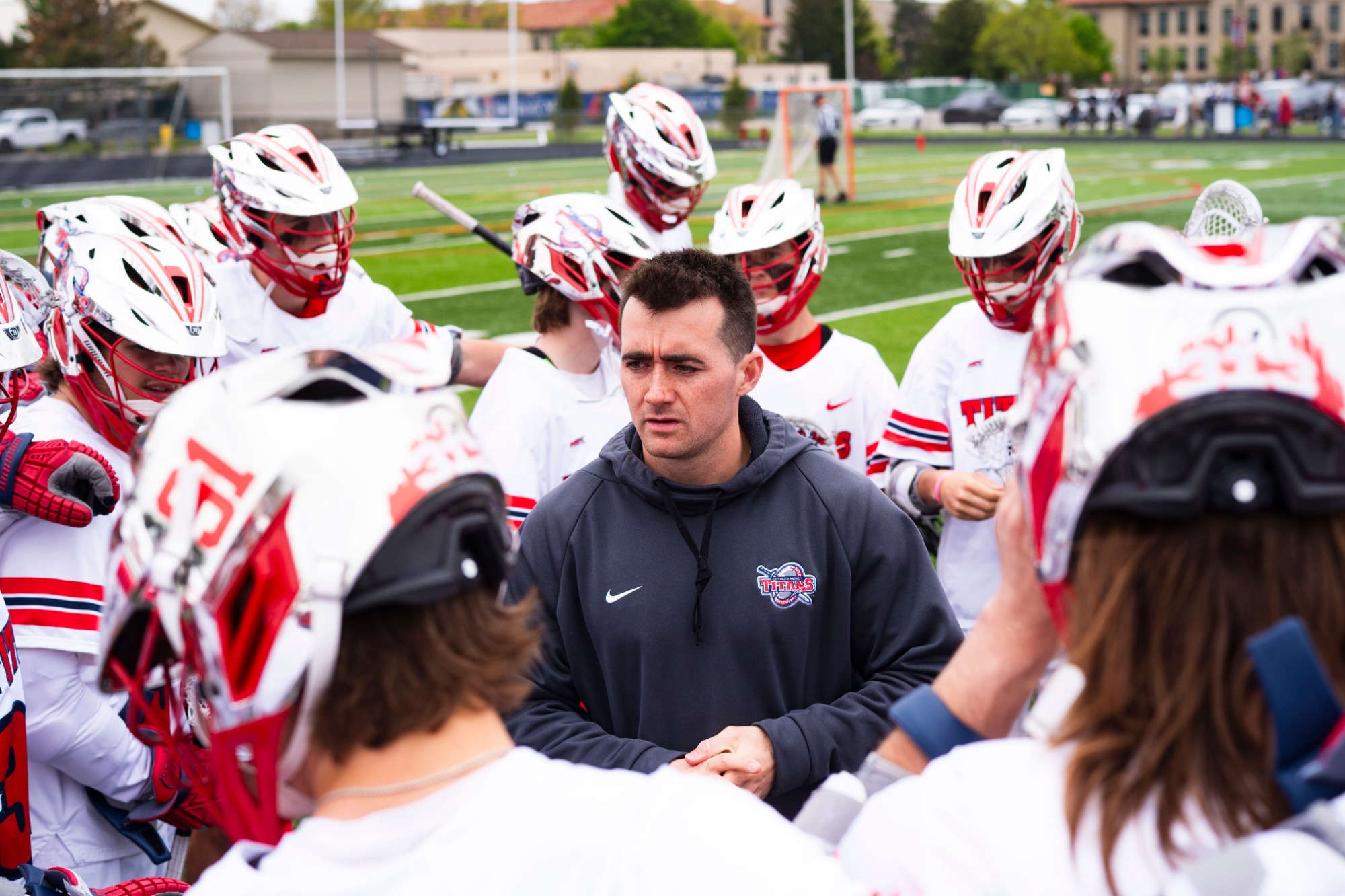 Head coach Charlie Hayes talks to the team 