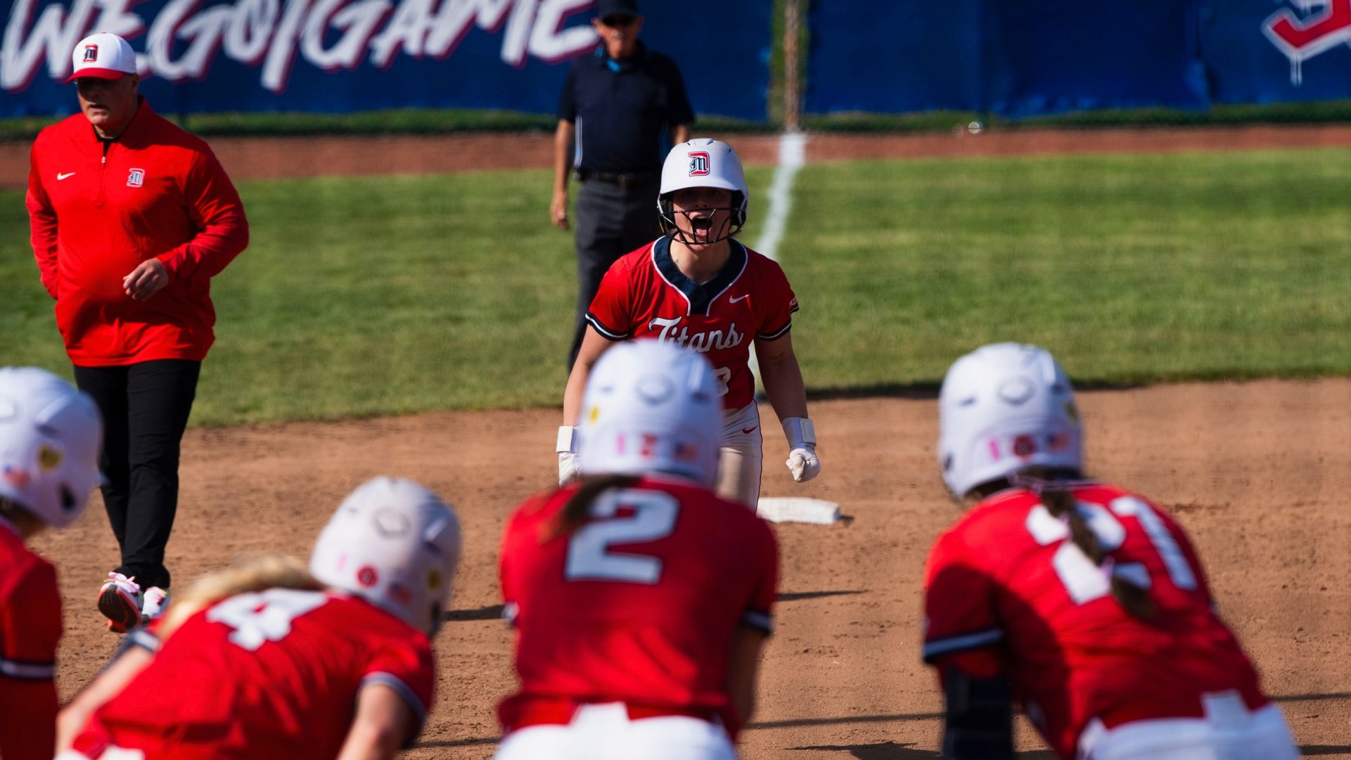 Trinity Fessler rounds third base to celebrate her home run