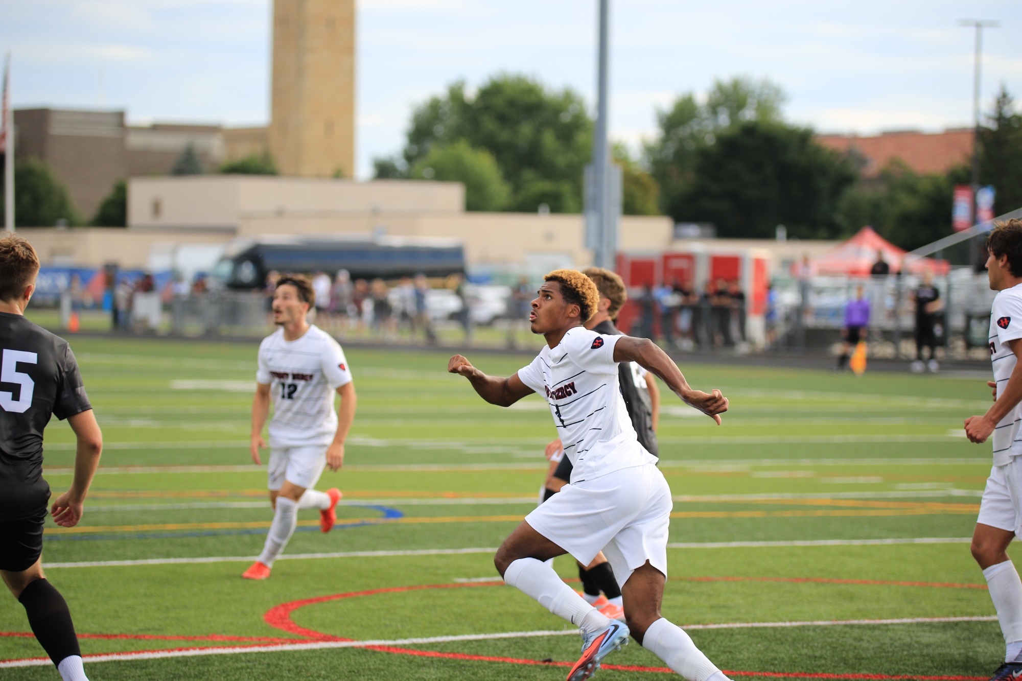 Tom Nkassa goes up for a cross