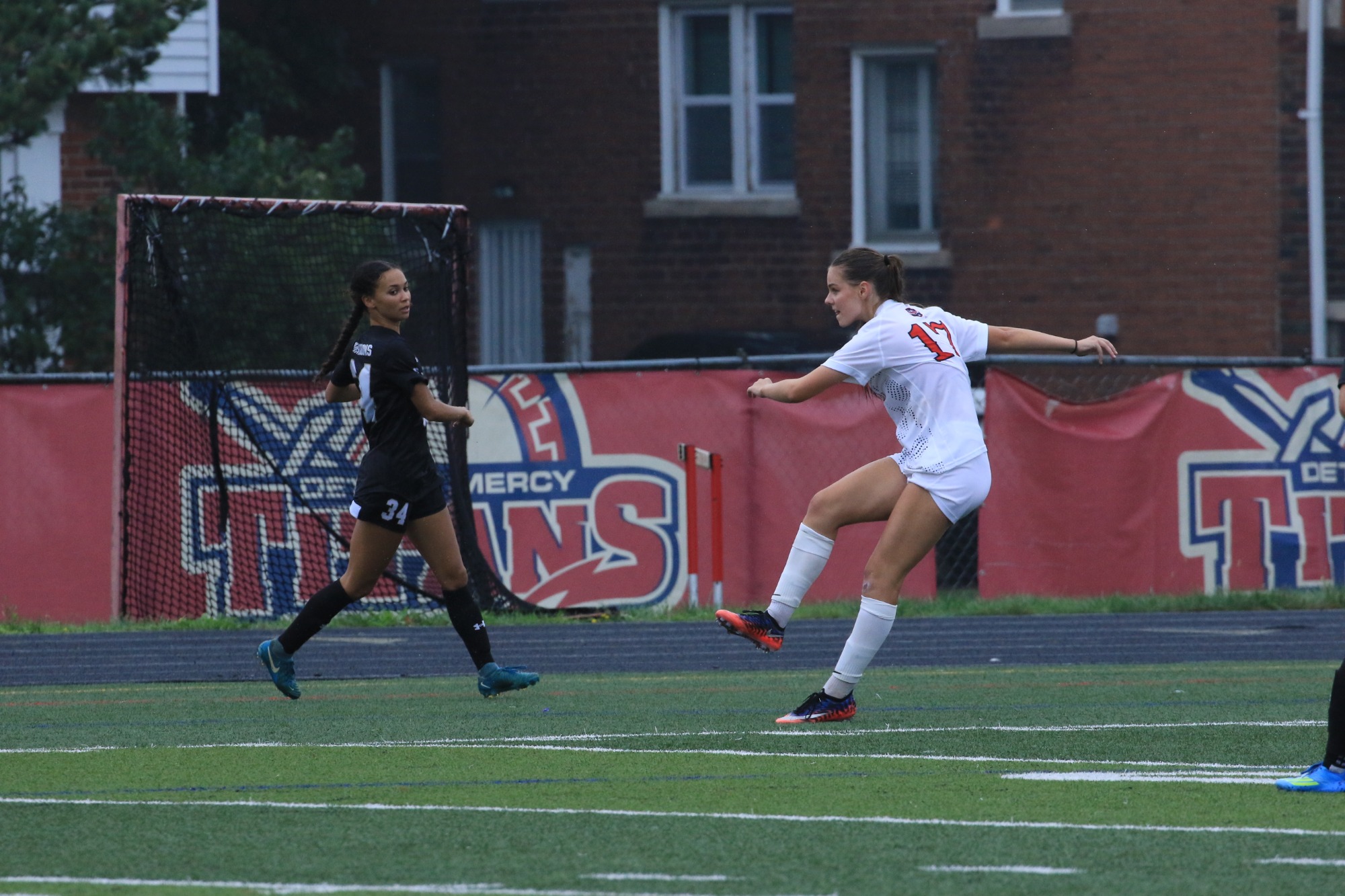 Elicia Clarkson kicks the ball away
