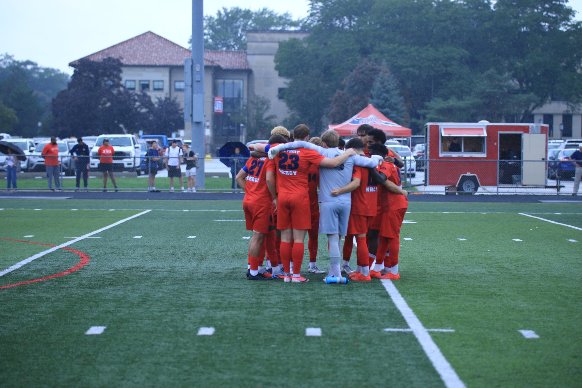 The starting XI huddle