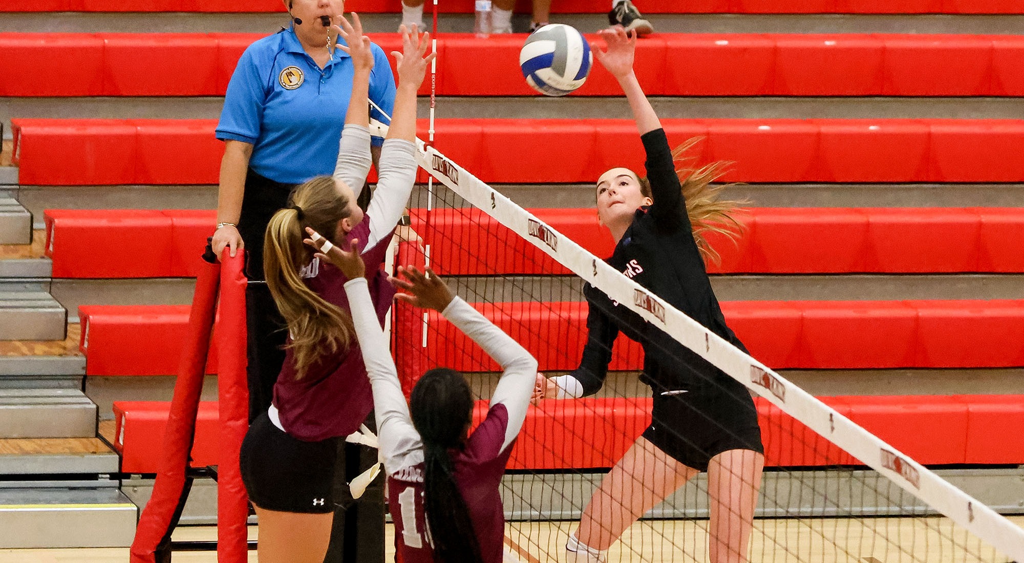 Melisa Ozsar spikes the ball against Concord