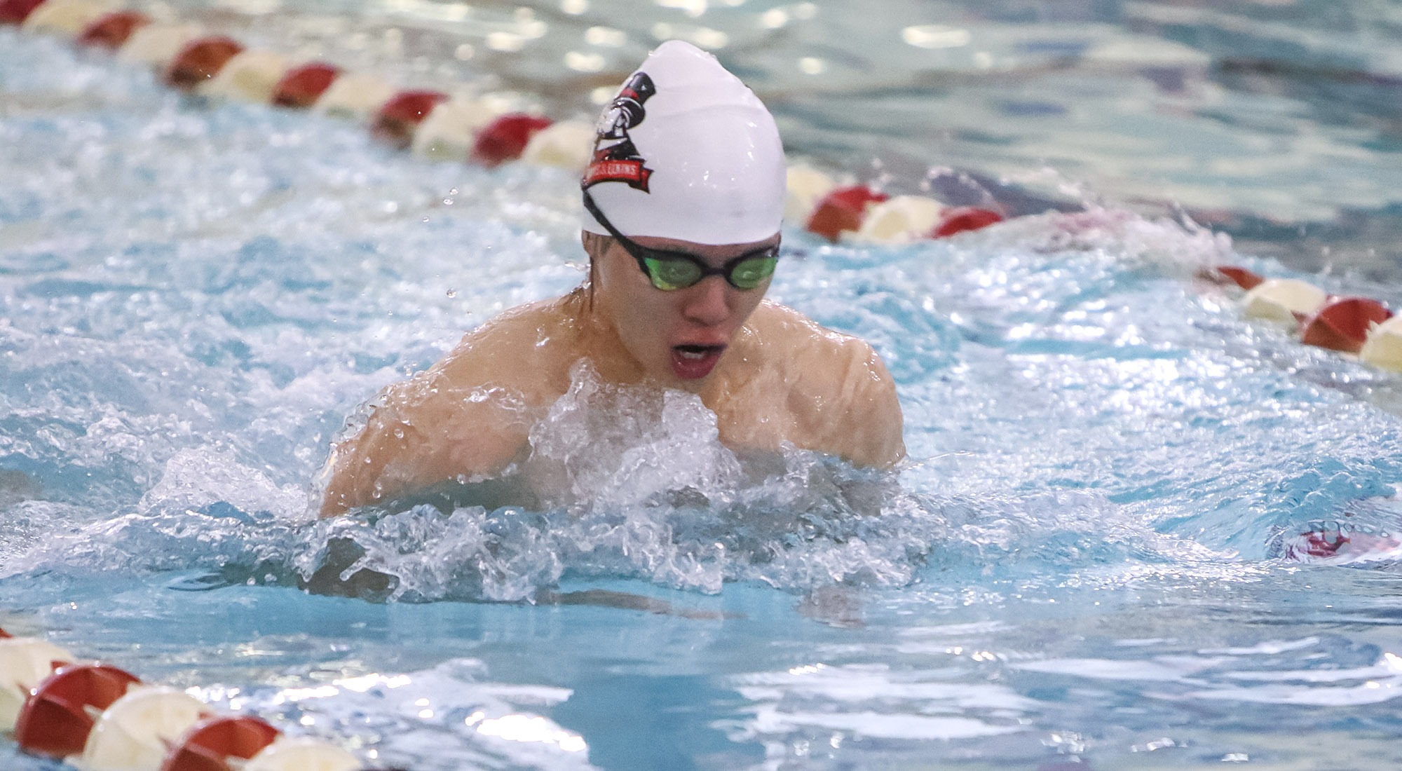 Edwin Li swims the breast stroke event 