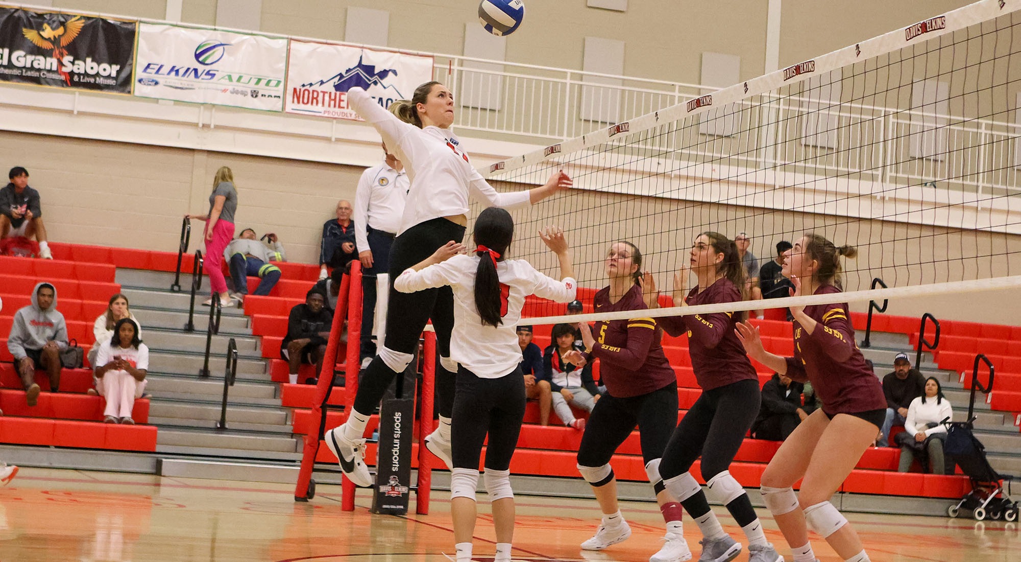 Gracjana Rozanska jumps for a ball over the net