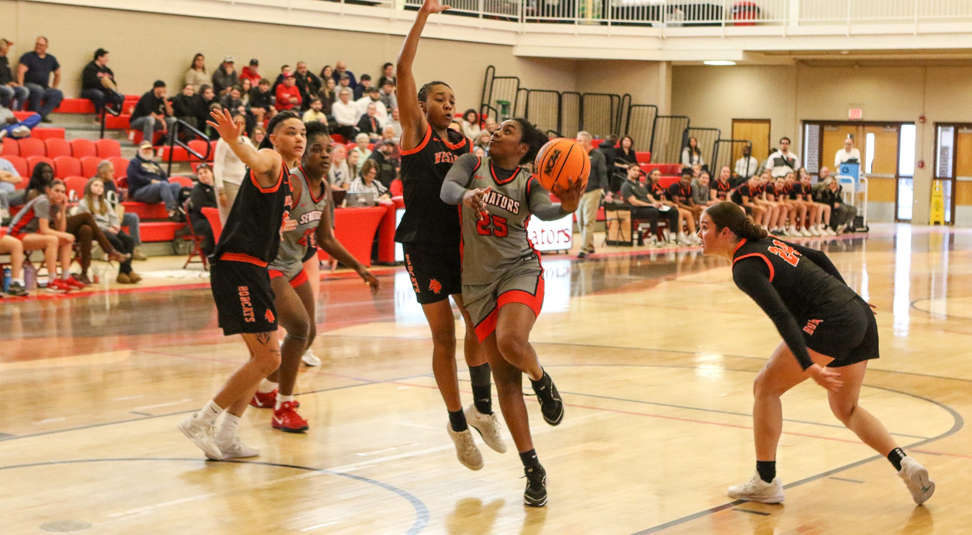 Josiany Canales drives to the basket