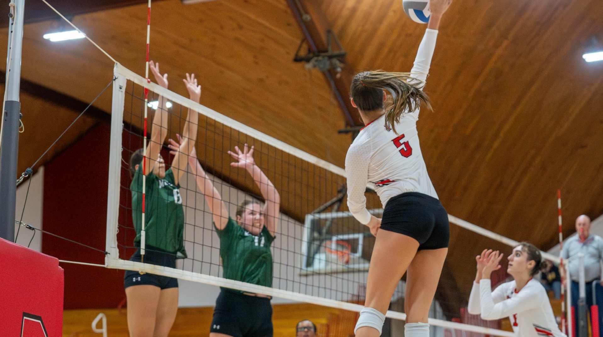 Mallie Thomas going up for a spike against McDaniel College during the 2024 season