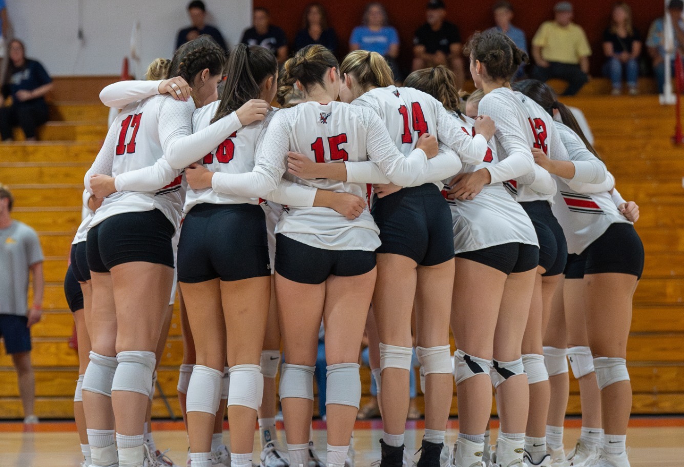Volleyball team huddle during the 2024 season