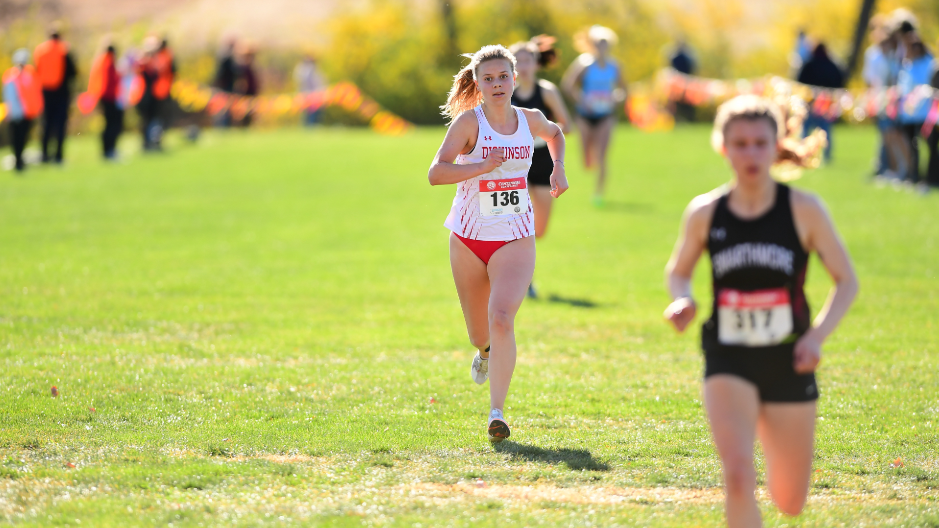 Maddie Garber crossing the finish line at the Centennial Conference Championship on 11-2-24