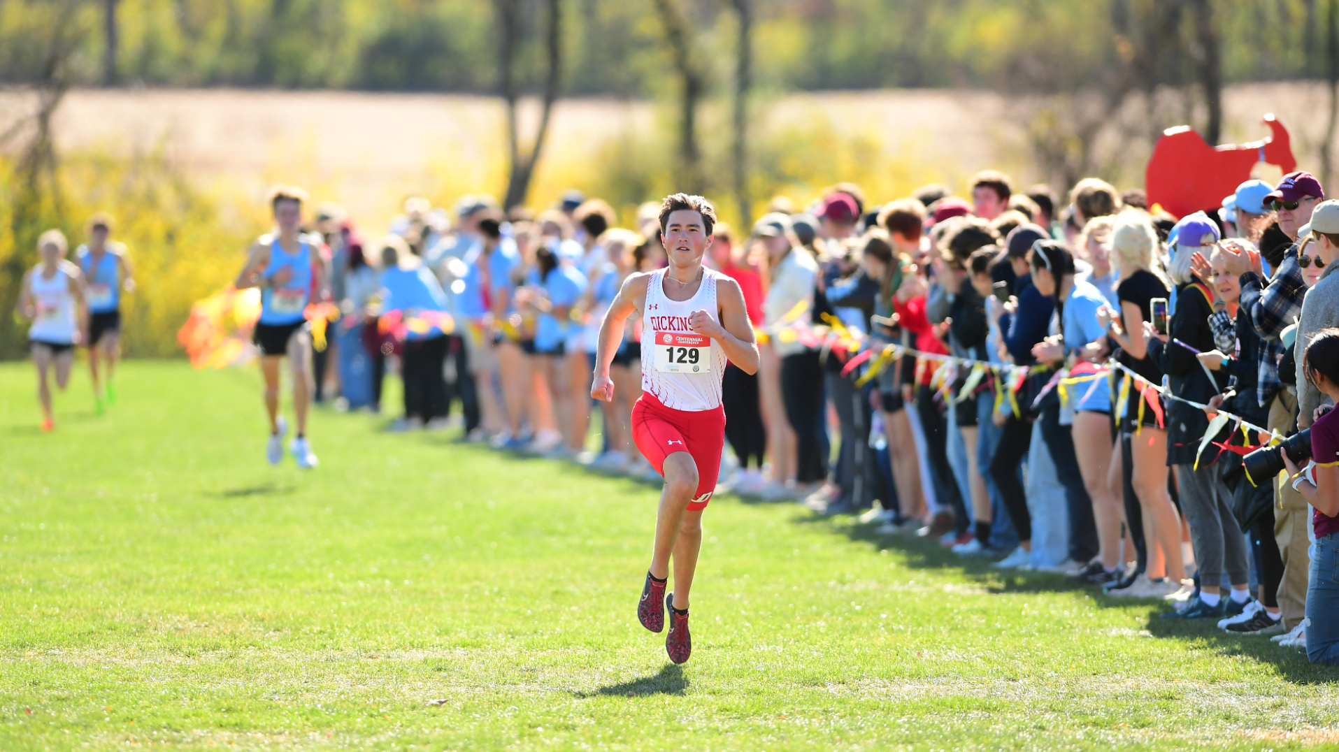 Brock Overlander crossing the finish line at the Centennial Conference Championship on 11-2-24