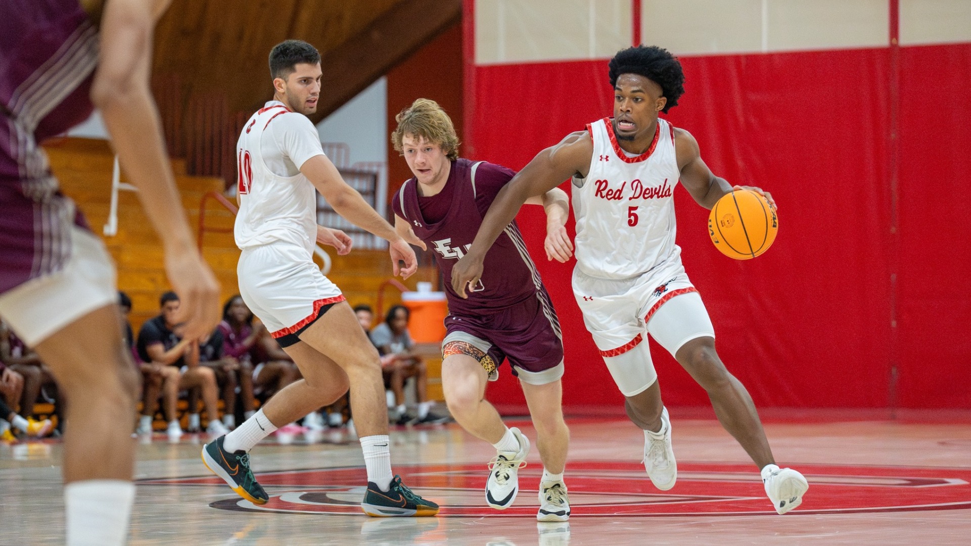 Isaiah Edmond dribbling around a screen from Petrusev against Eastern University 11-16-24