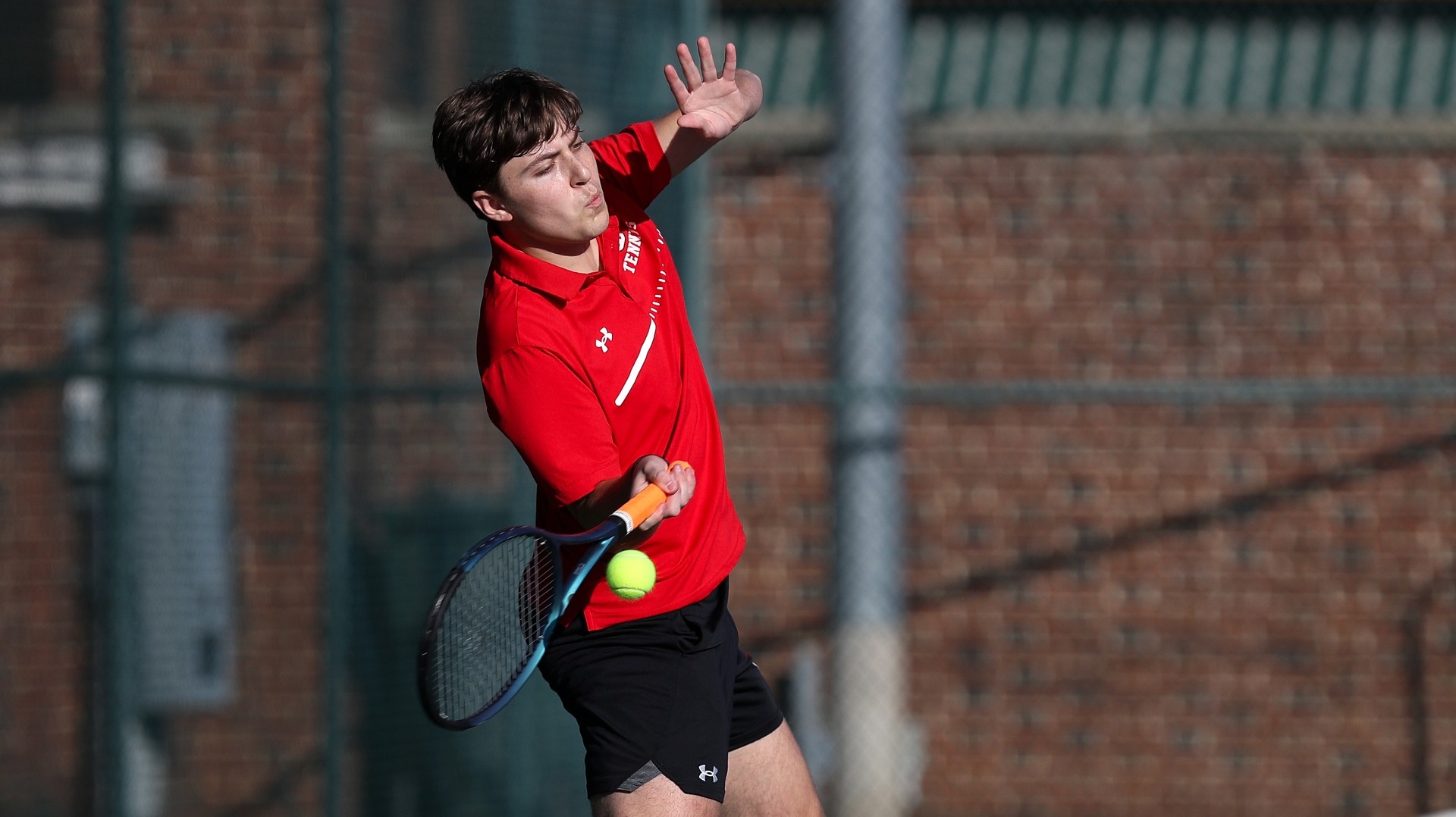 Drew Allen going for the forehand against Albright College on 3-7-24