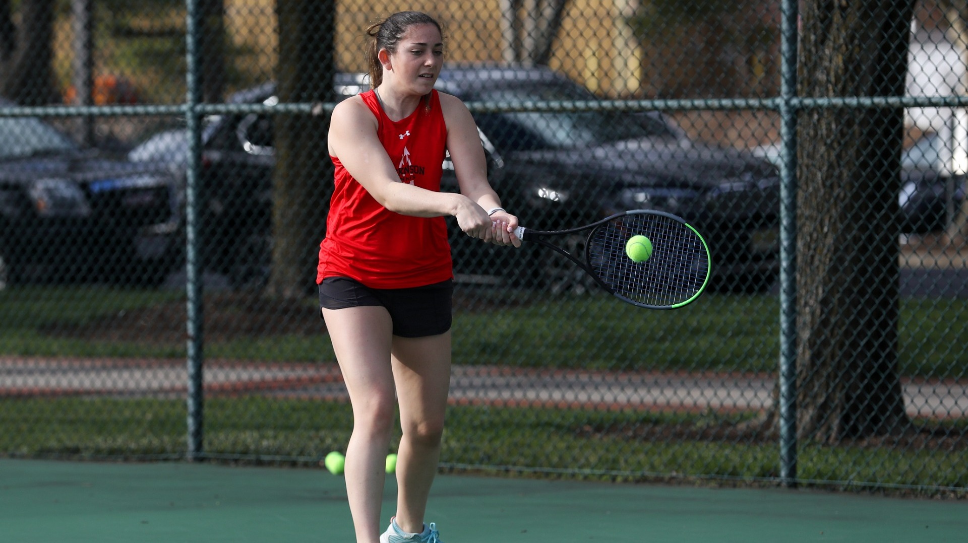 Jenna Crain with the two-handed backhand against Albright College on 3-7-24