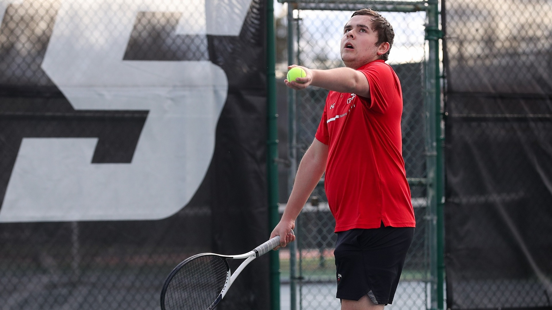 Drew Allen getting ready for a serve against Albright College on 3-7-24