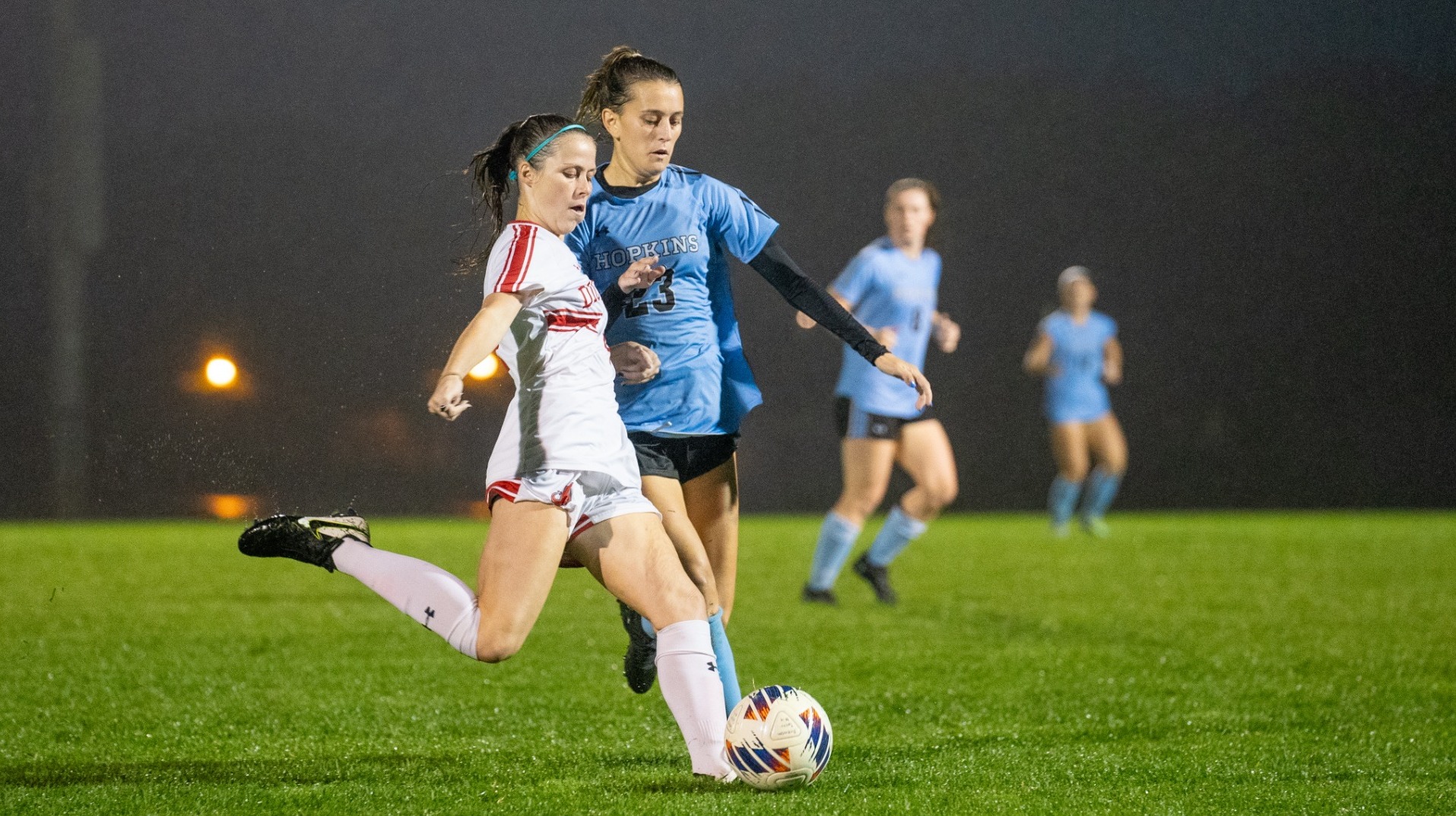 Maddie St. Amand trying to hold off a defender against Johns Hopkins 9-25-24