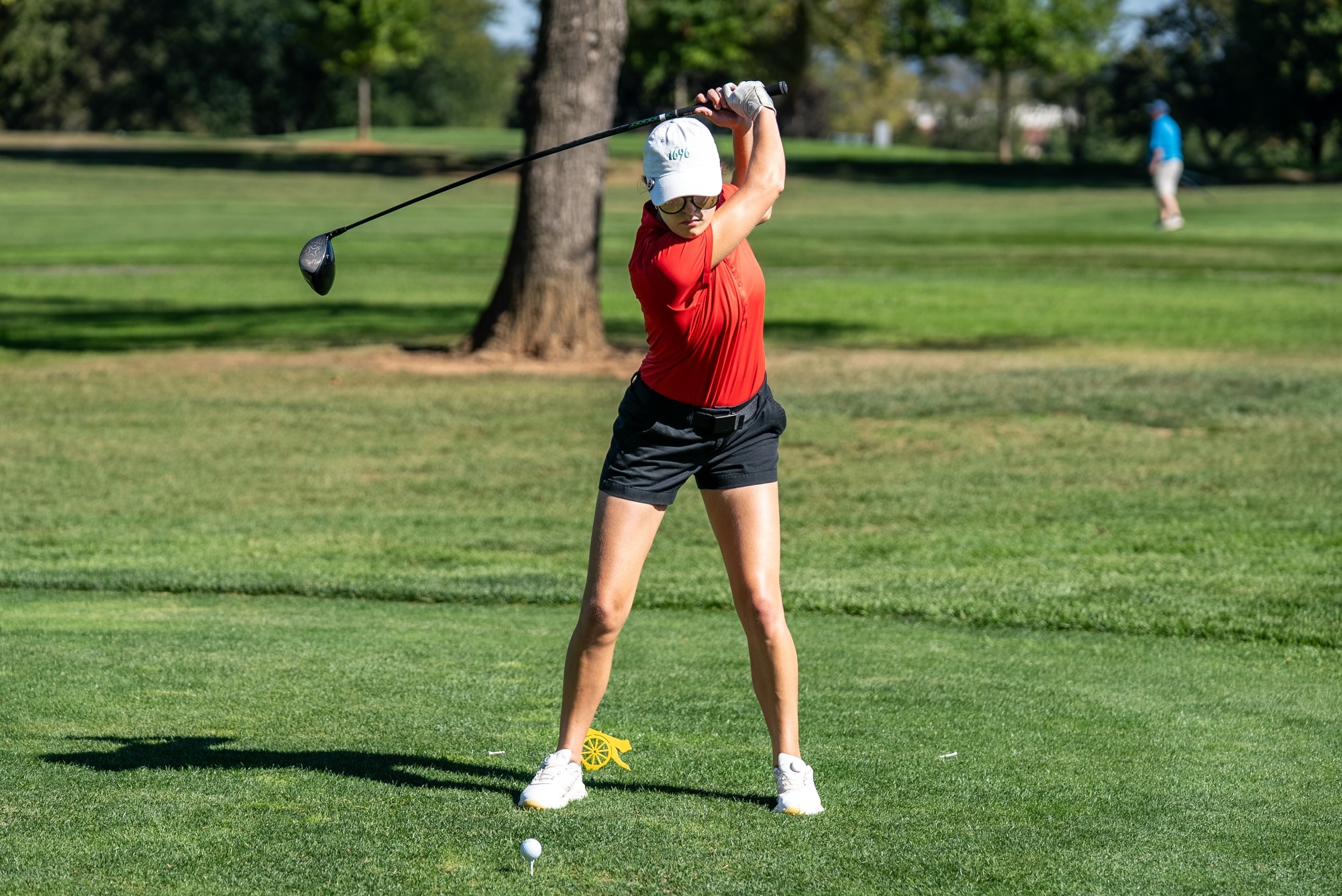 Charlotte Anstine tees off