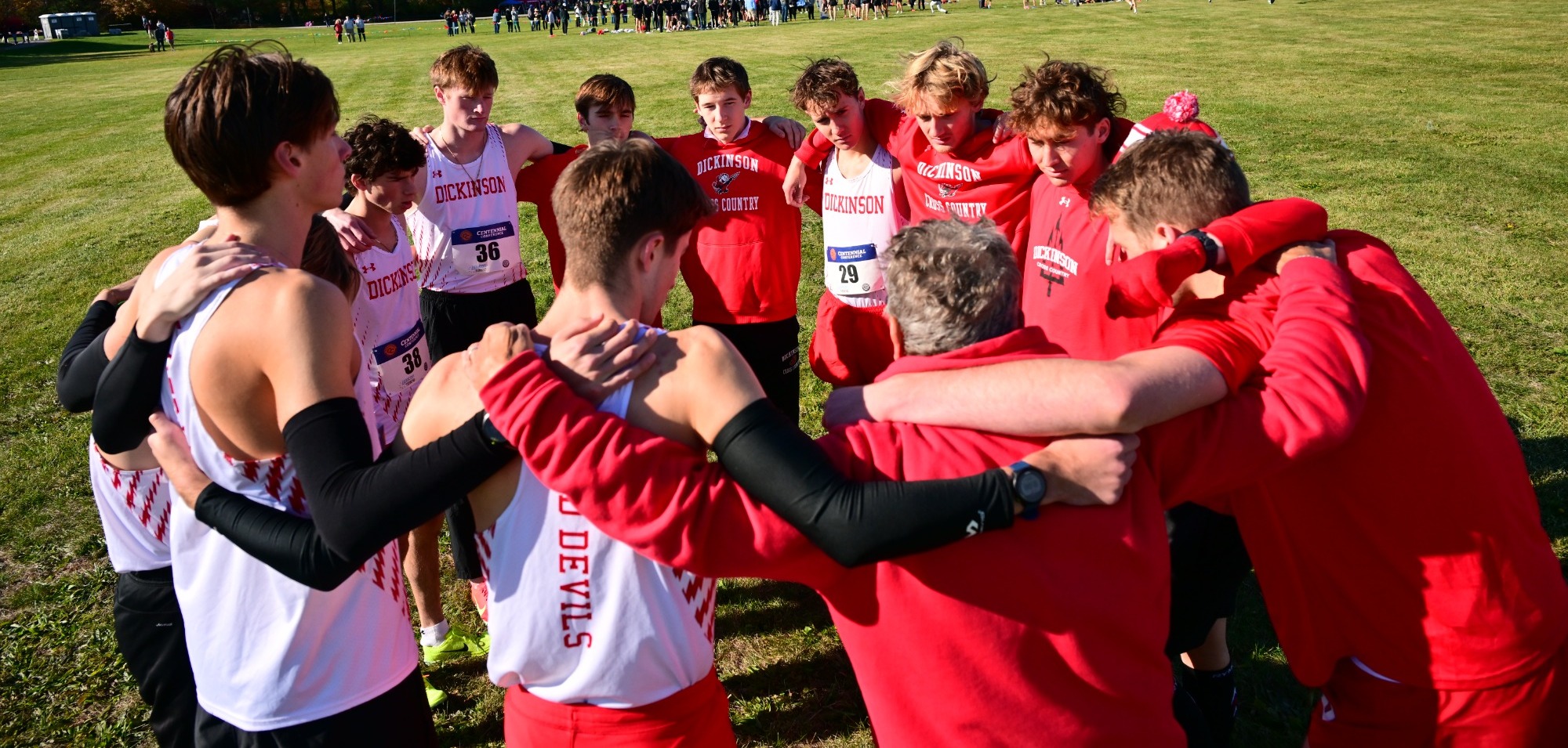 Dickinson Men's XC huddles up before the 2025 Centennial Championships