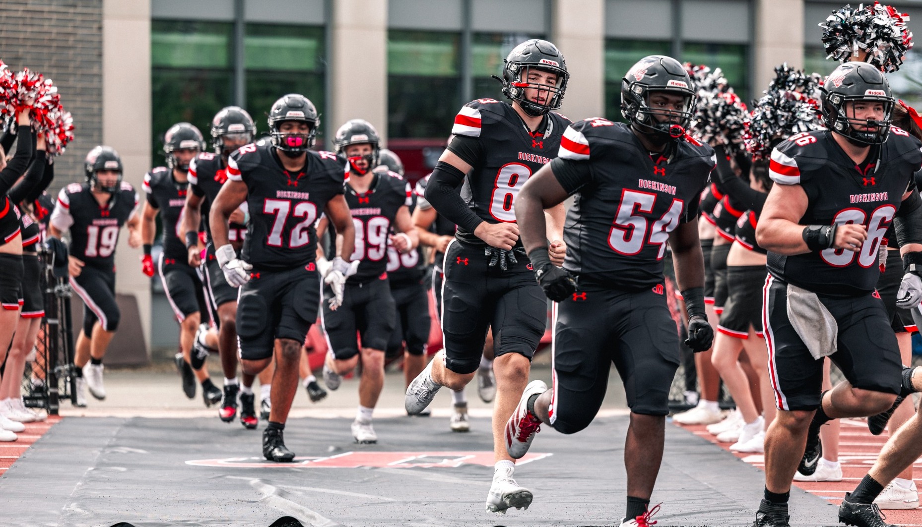 Dickinson football team running out of the tunnel against Gettysburg College on 10-11-25