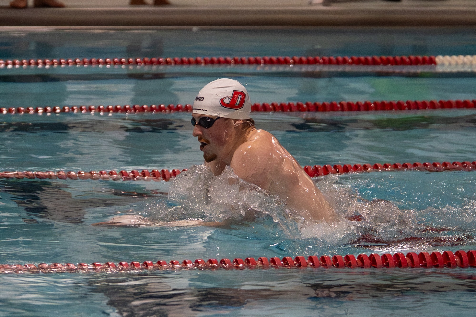 Men's swimmer Andrew Kelley competes 