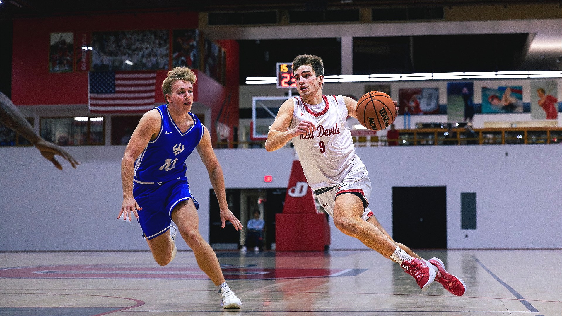 Joey Dopirak dribbling around a Washington and Lee defender on 11-22-25