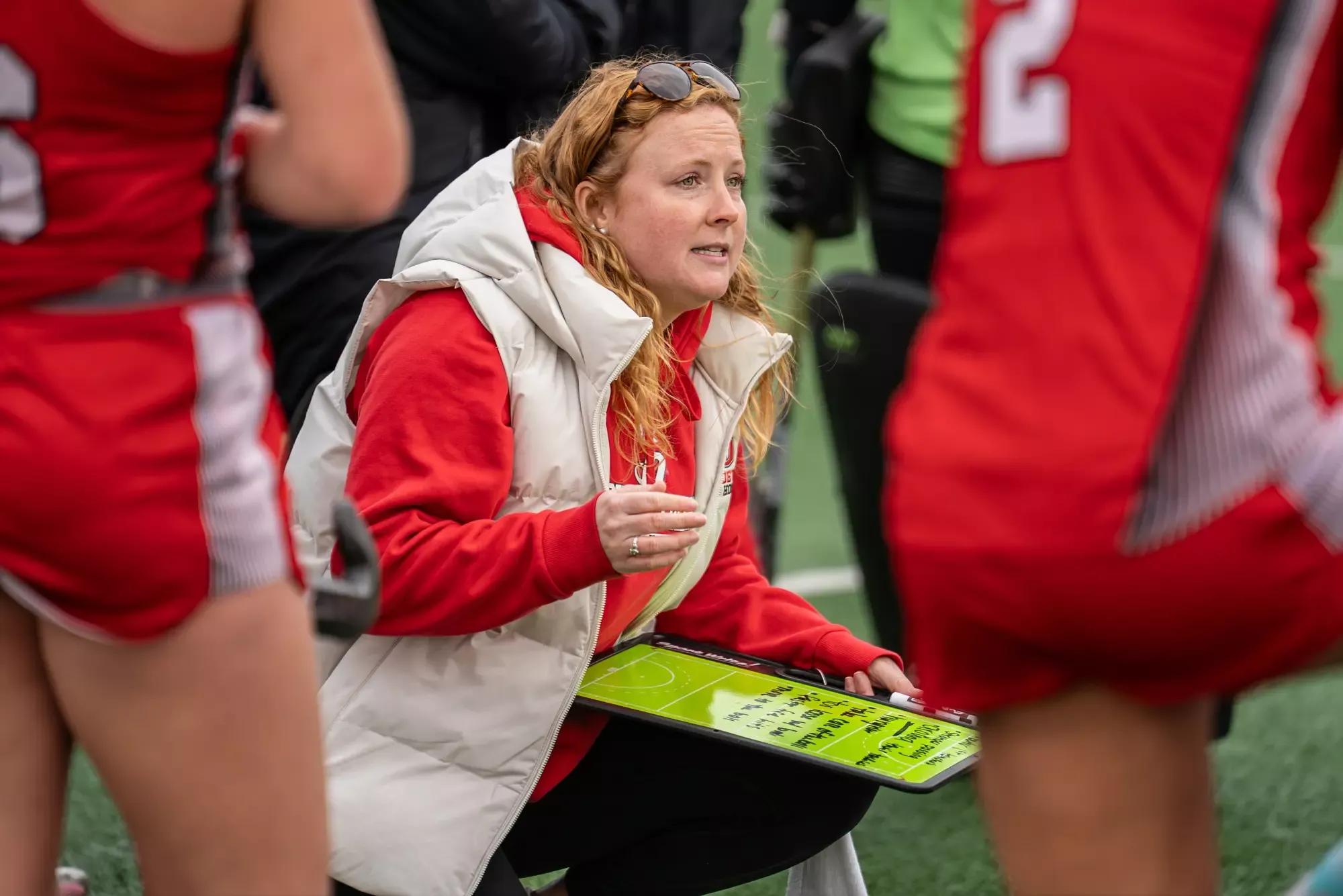 Coach Sohns talks with her team
