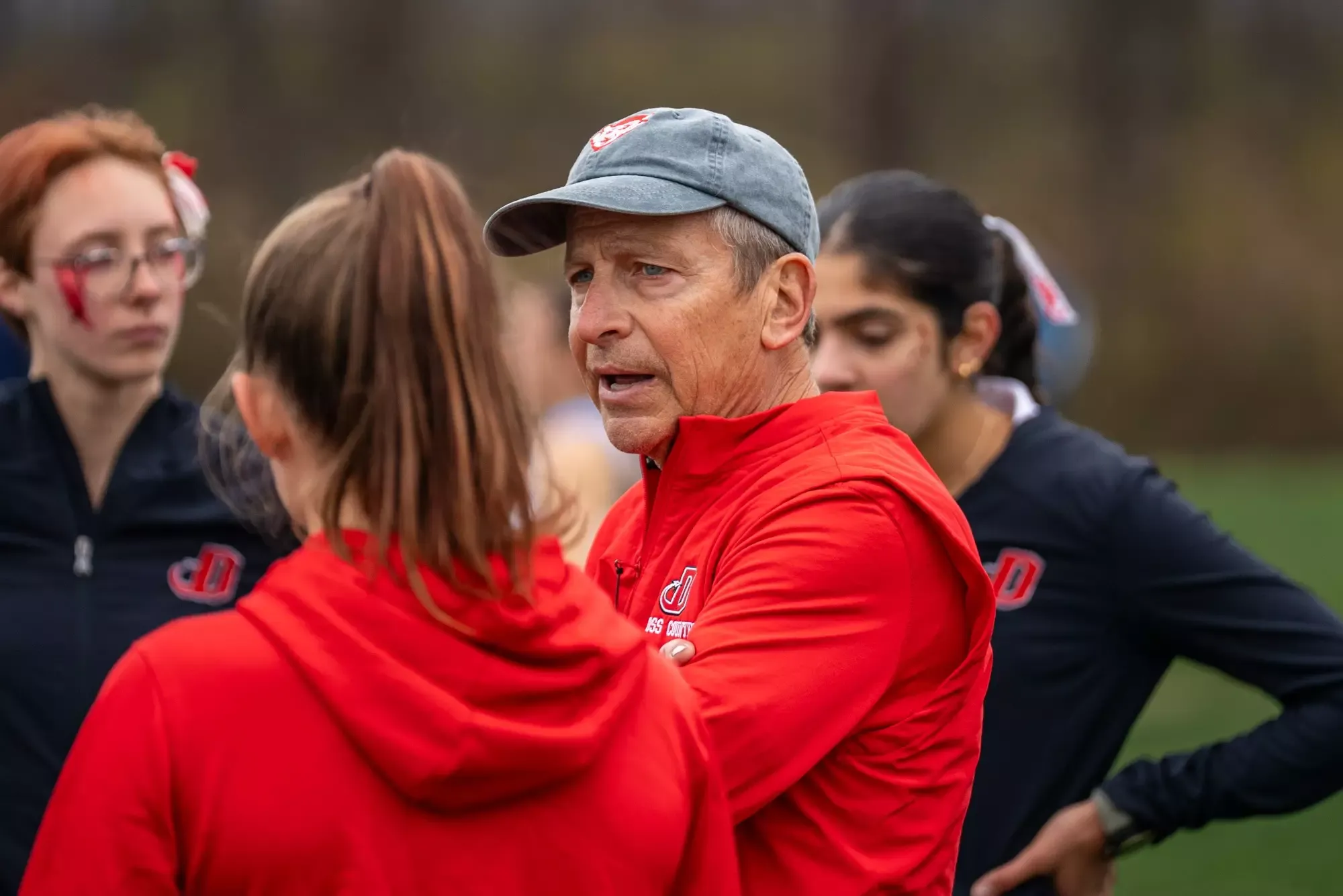 Coach Nichter talks with his team