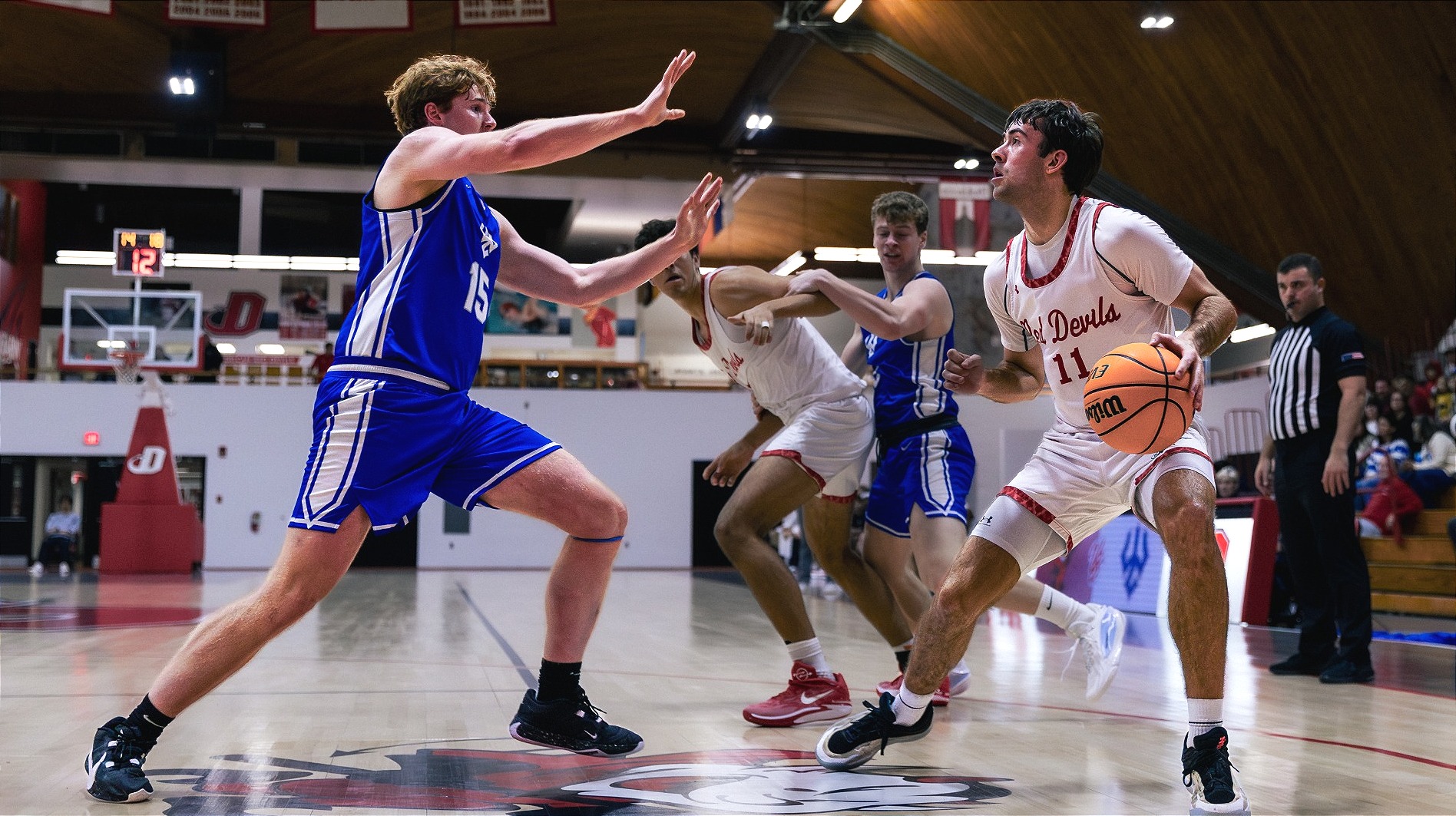 Cole Cosby backing off on the dribble against Washington and Lee University on 11-22-25