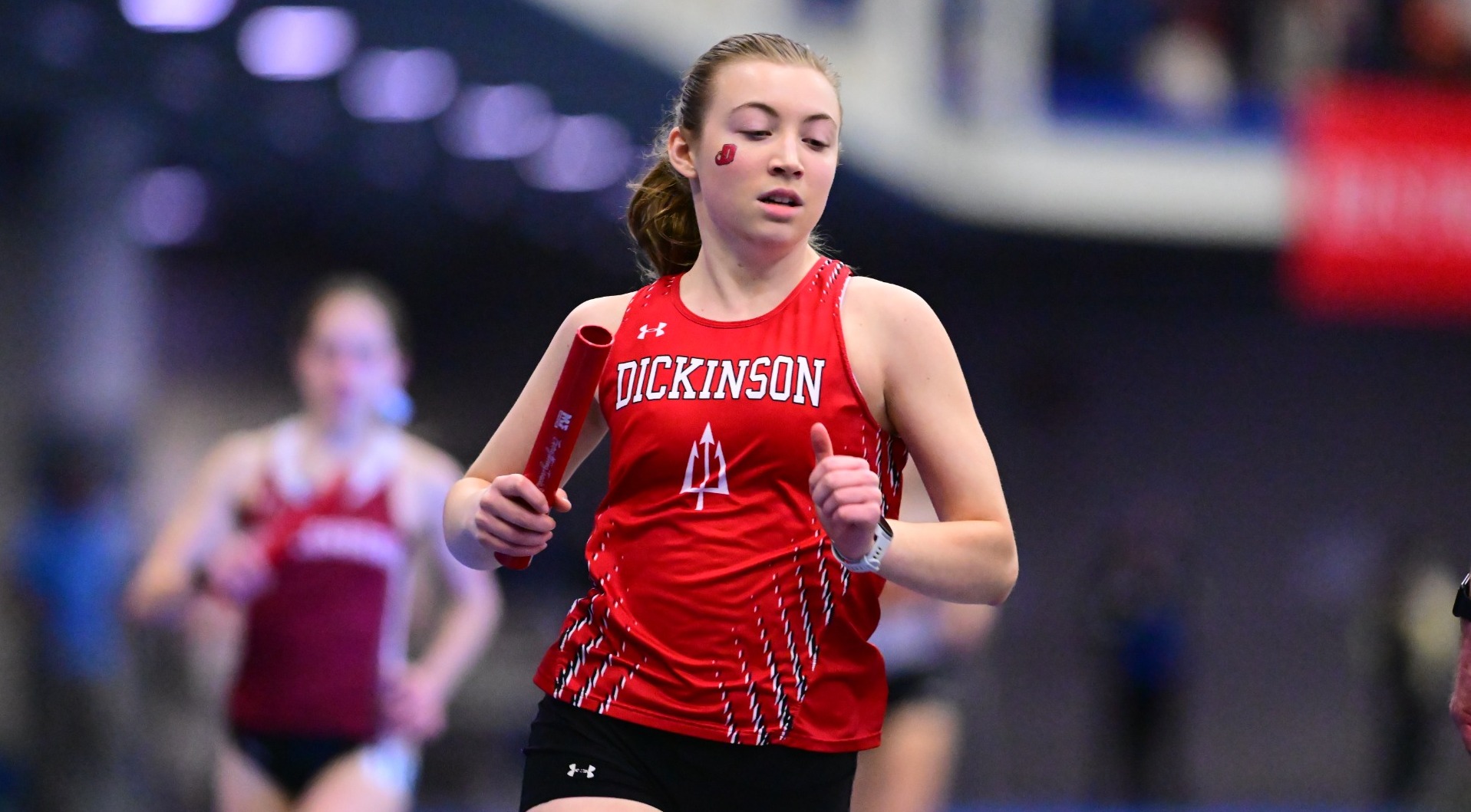 Dickinson women's track athlete running a race at the Blue-White Open at Franklin and Marshall during the 24-25 season