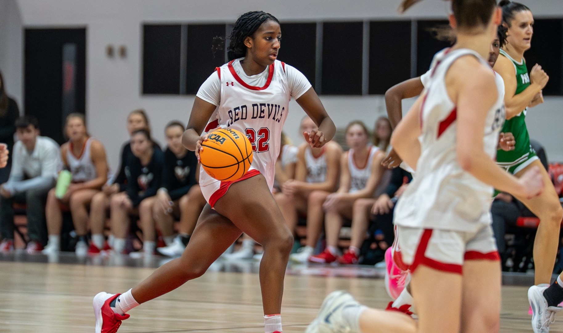 Jessica Maina dribbling forward against York College of Pennsylvania on 12-9-25