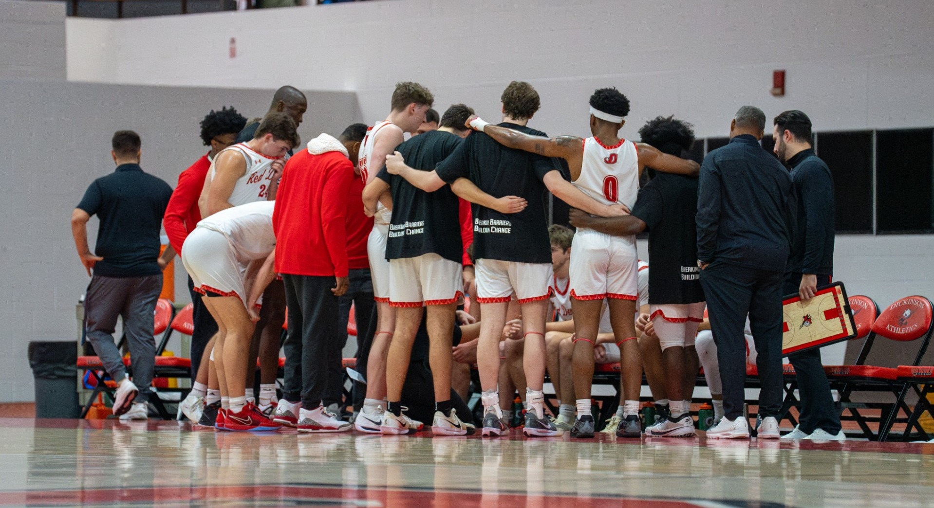 Dickinson men's basketball team huddle at the bench against Gettysburg on 1-22-25