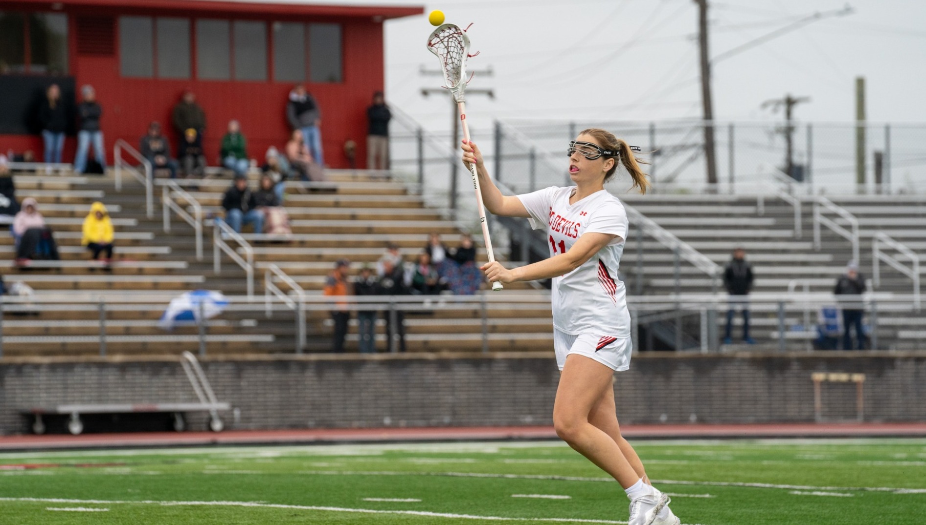 Bella Guckes making a pass against Denison University on 2-25-24
