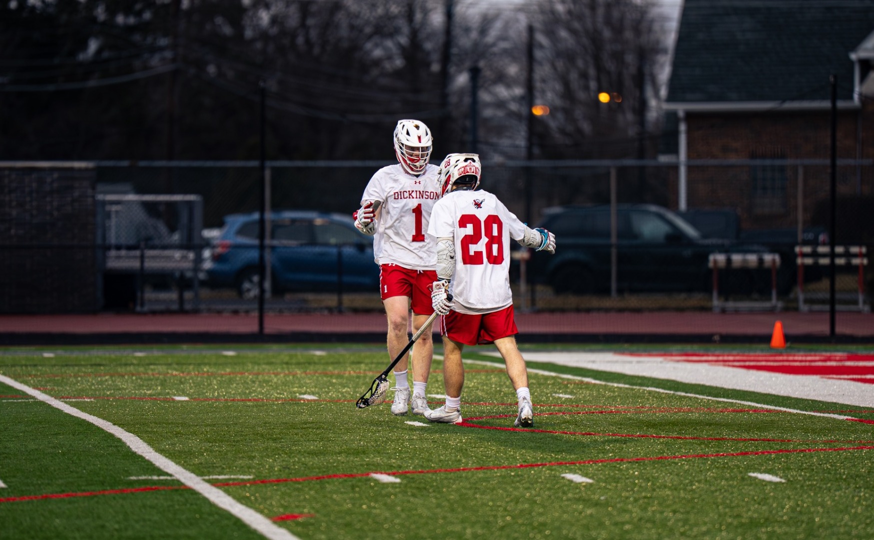 Ramsey Huggins and Tommy Baldini celebrating a goal against Kenyon College on 3-5-25