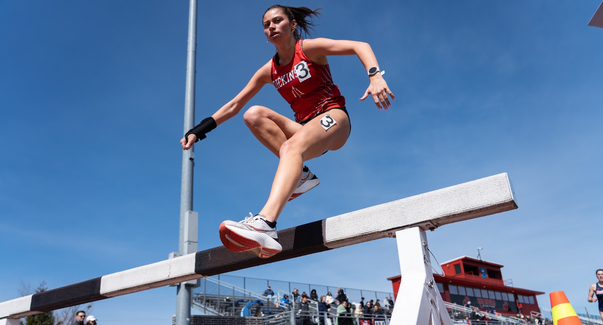 Amiyah Priebe running the steeplechase at the Little Three Championship on 3-23-25