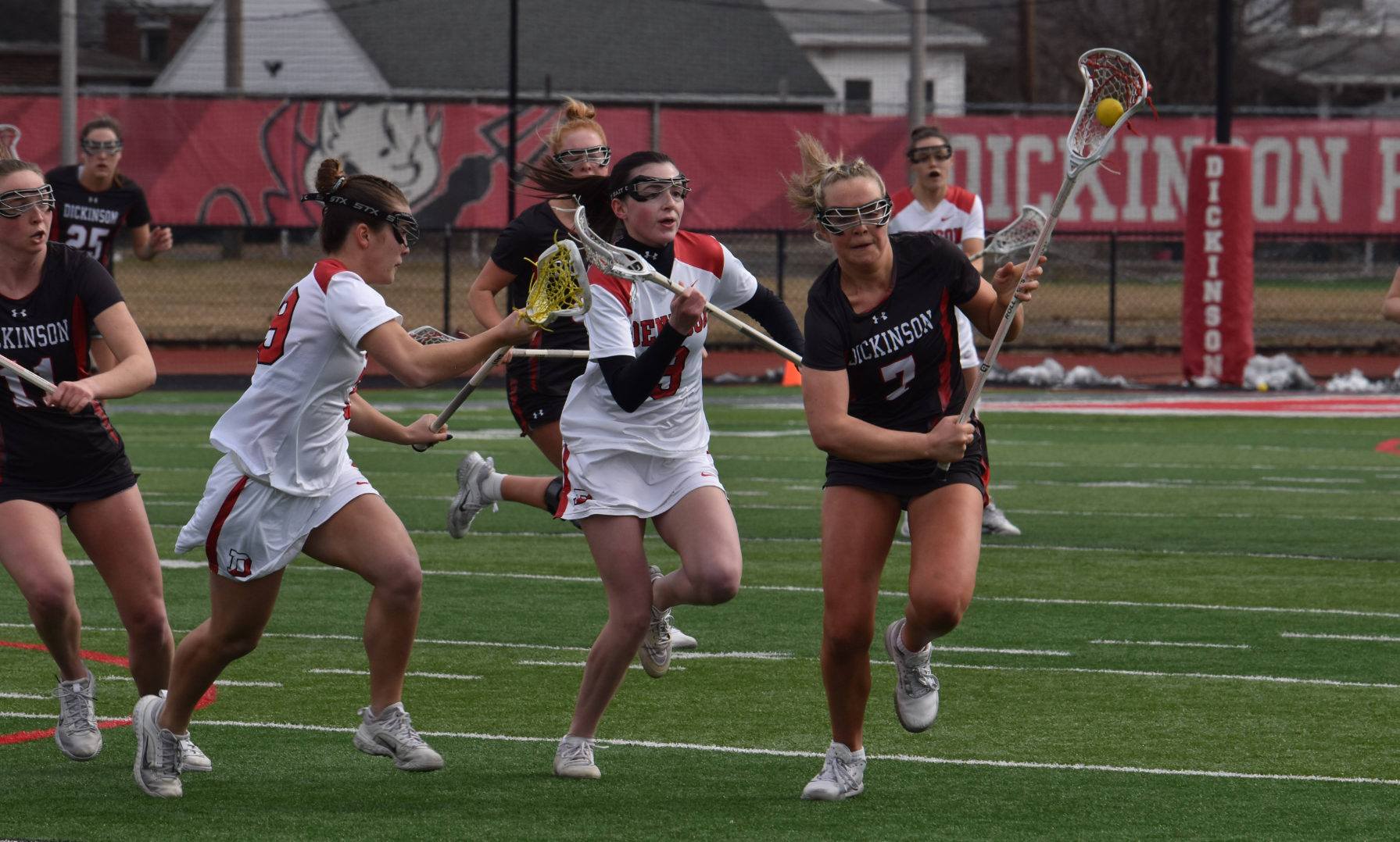 Faith Parker running down the left side of the field against Denison University on 2-23-25