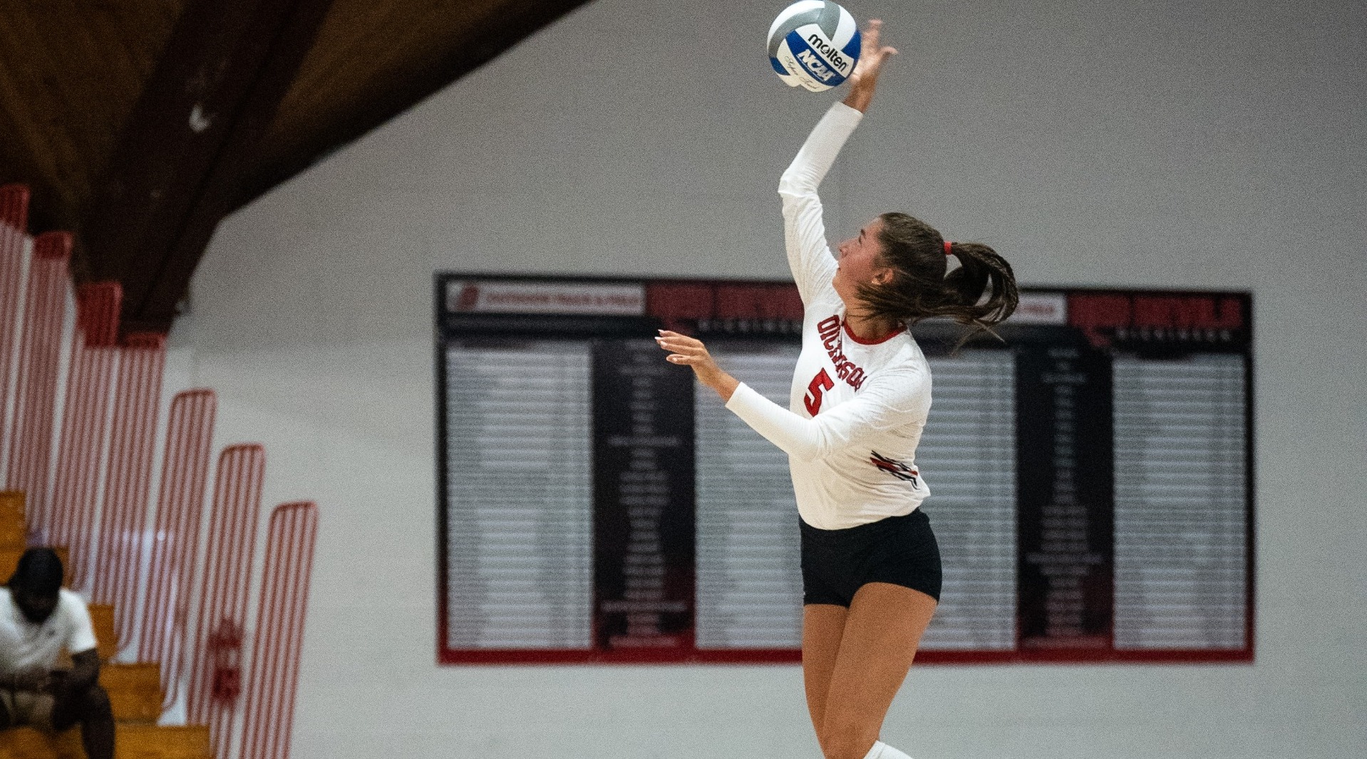 Mallie Thomas hitting a serve against Penn State Harrisburg on 9-3-25