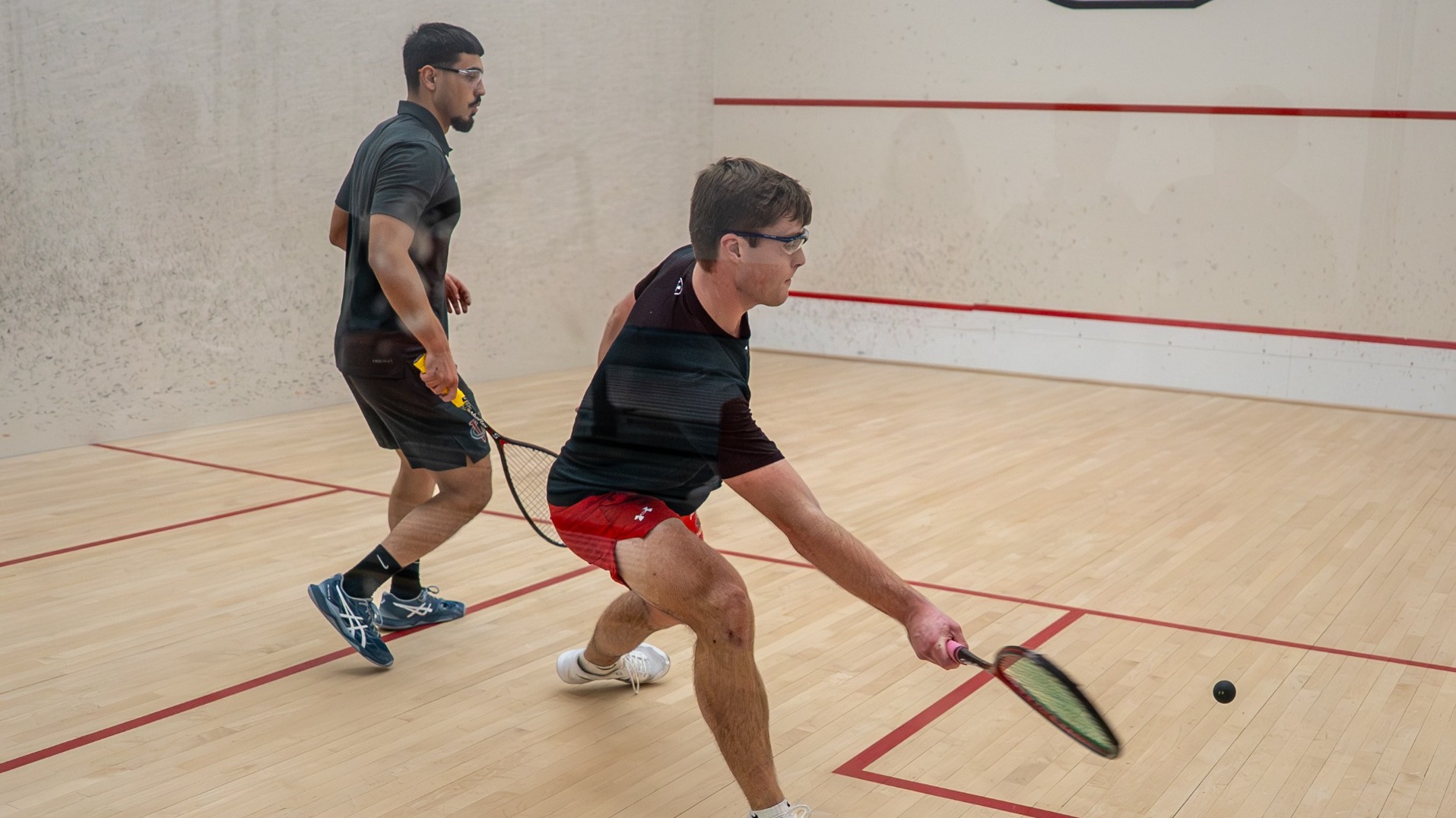 Cormac Sullivan going for a forehand shot against Vassar College on 1-17-26