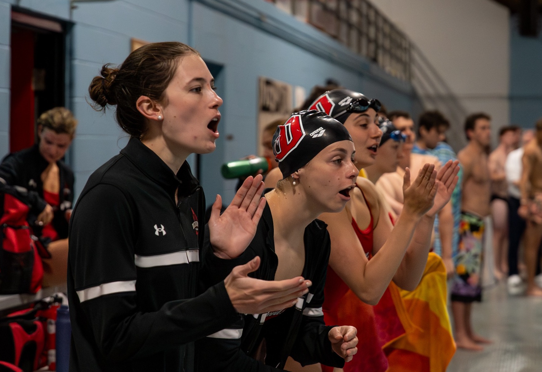 Dickinson swimmers cheer on their teammates