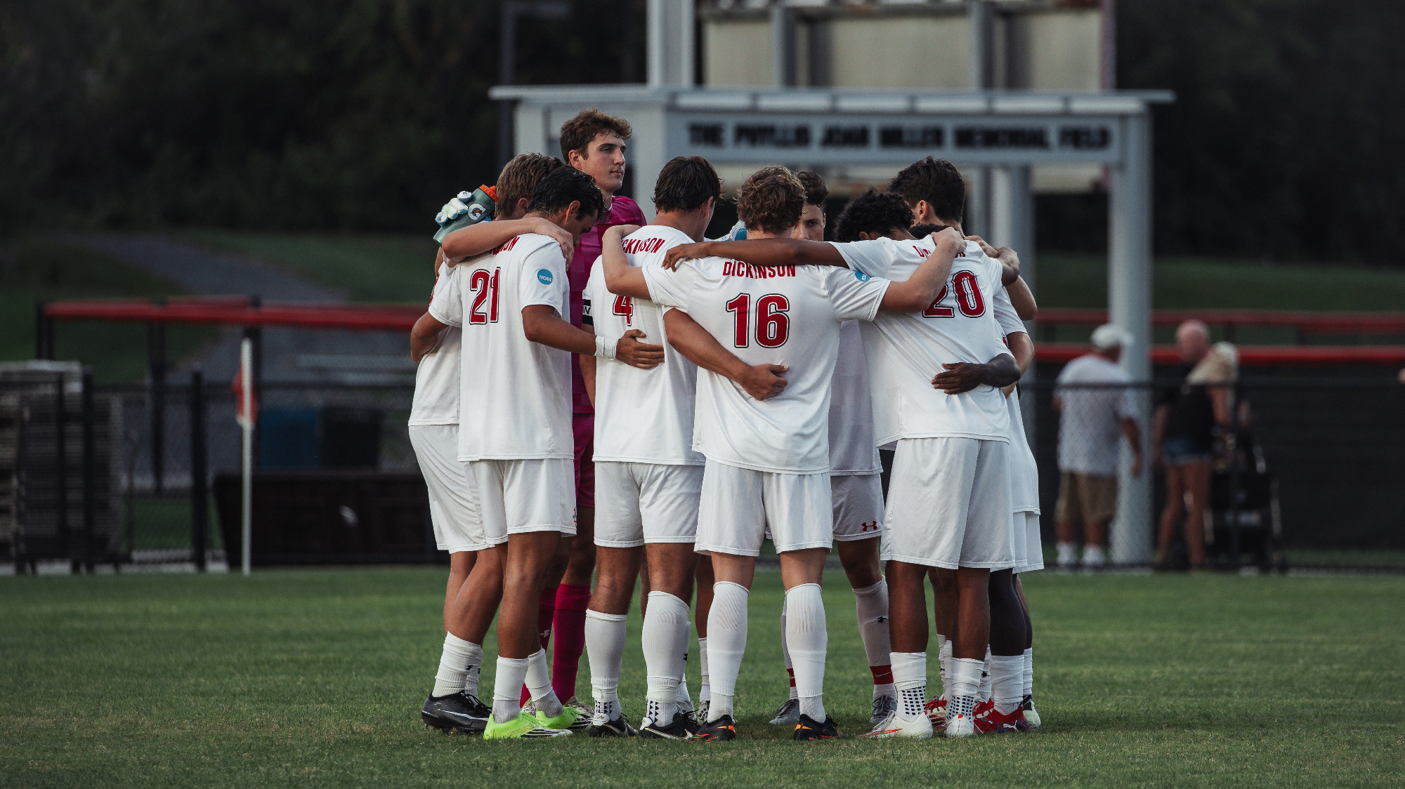 Dickinson Men's Soccer team huddle before their matchup against Rowan