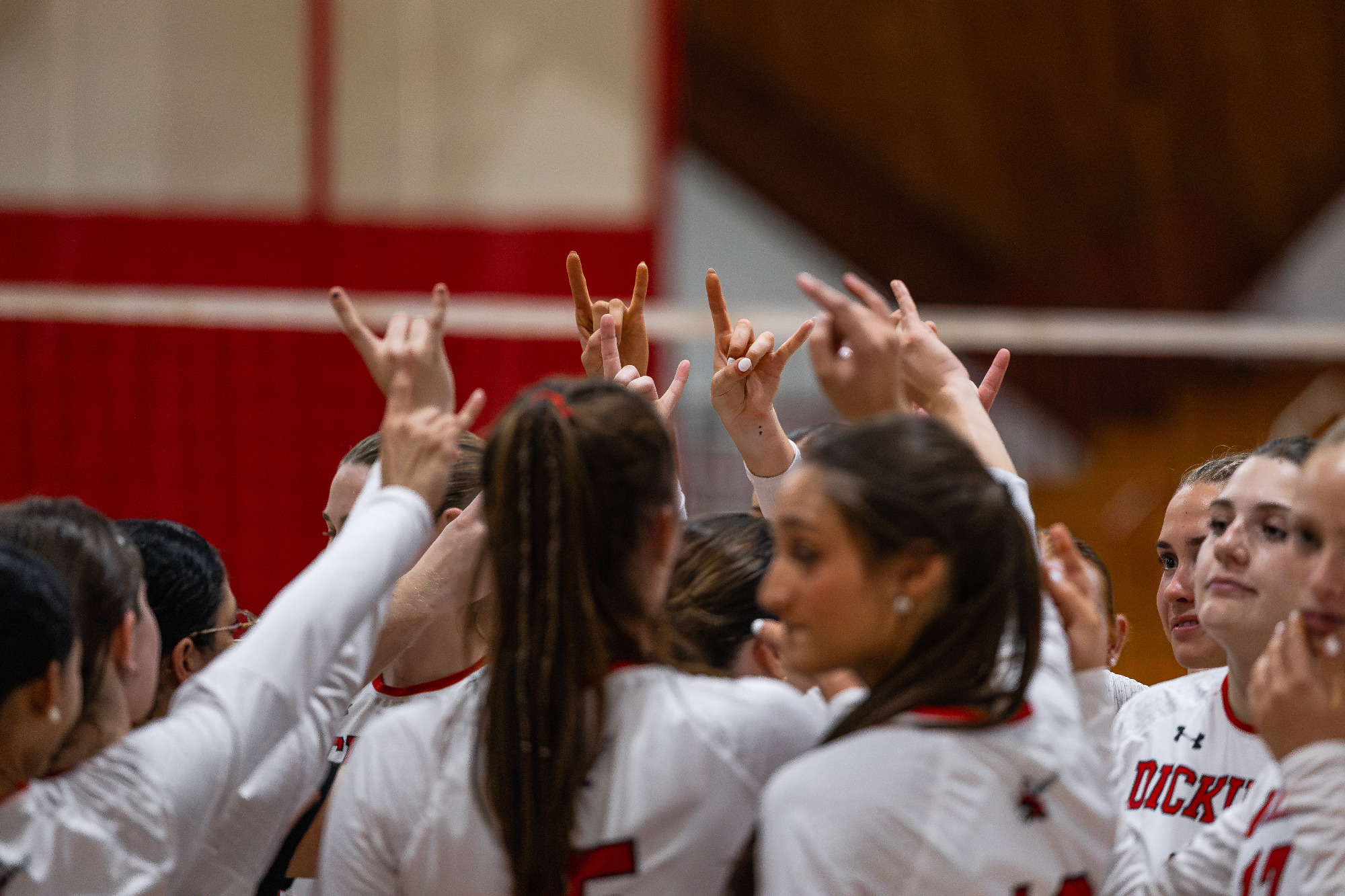 Dickinson Volleyball Team huddle vs Misericordia