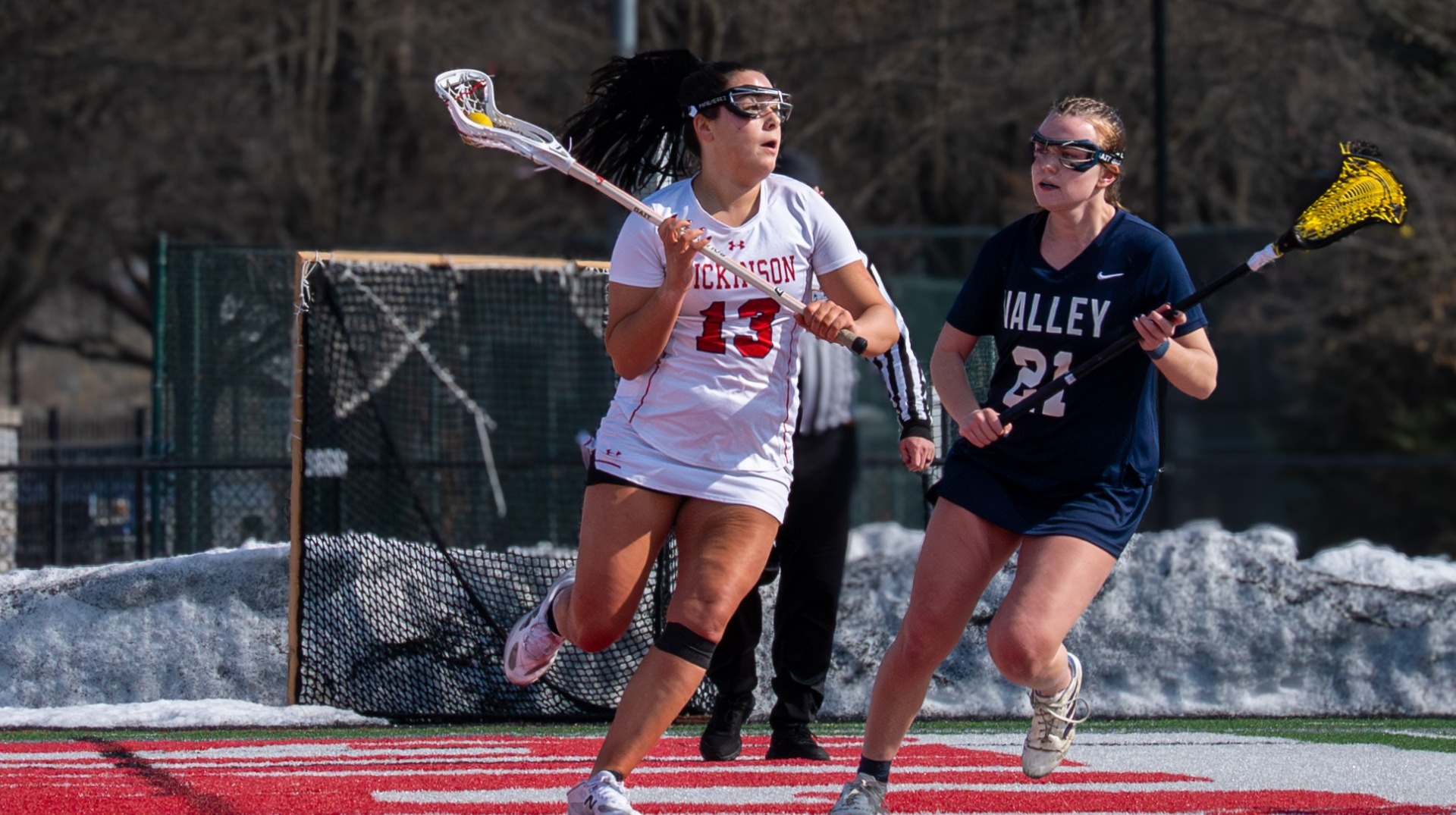 Abby Geary looking to make a pass against Lebanon Valley College on 2-14-26