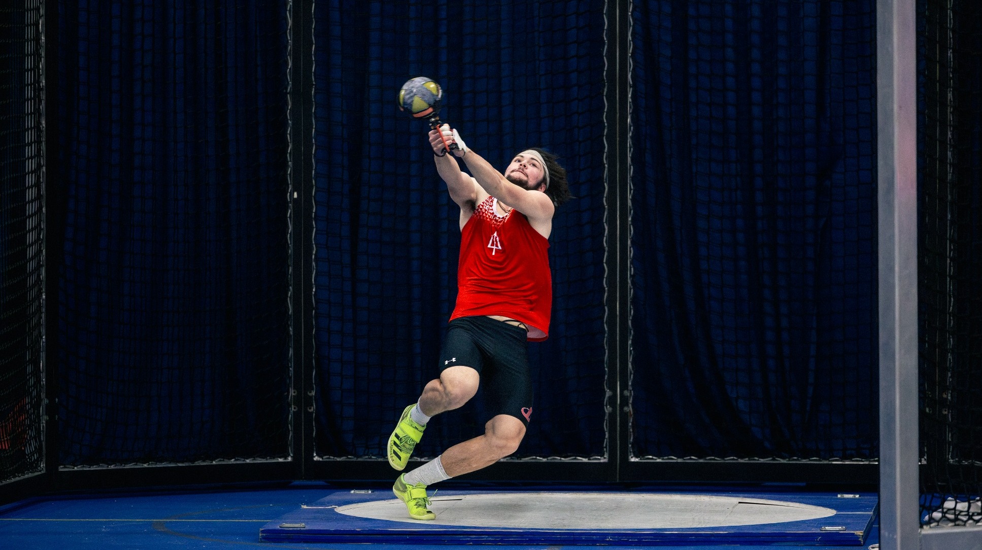 Dickinson track and field member competes in the weight throw