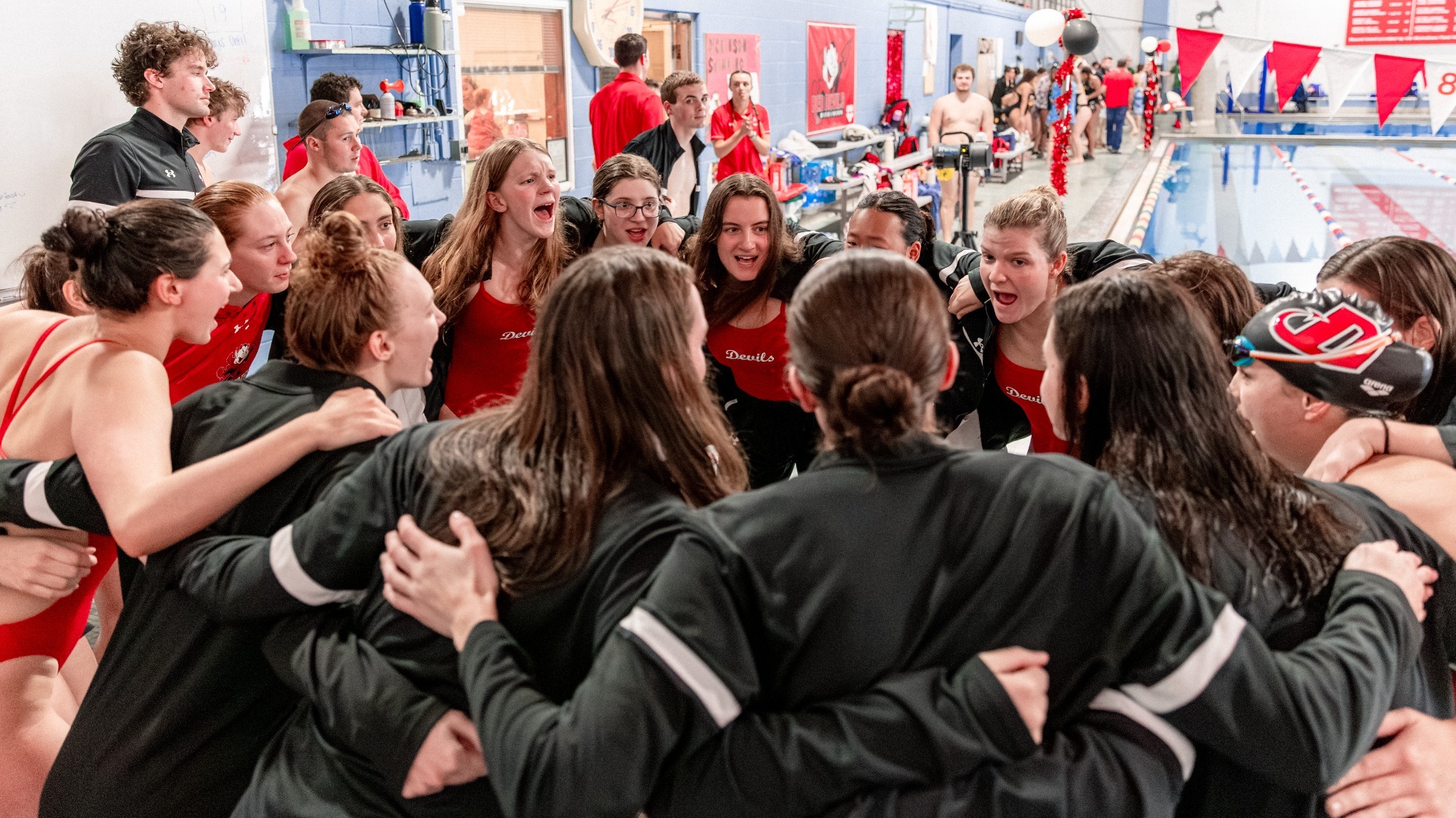 Dickinson women's swimming cheers before a meet