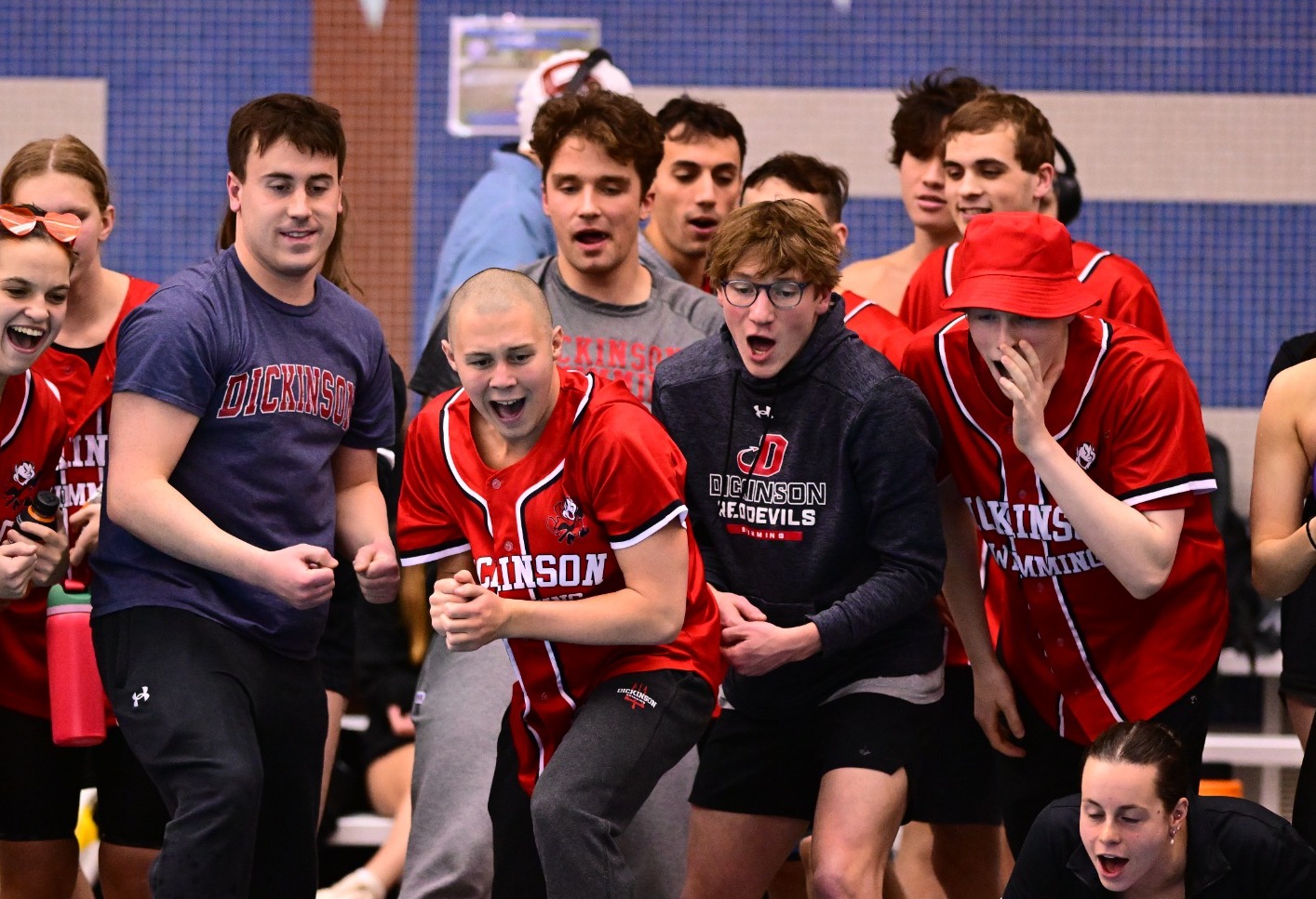 Dickinson men's swimmers cheer on their teammate