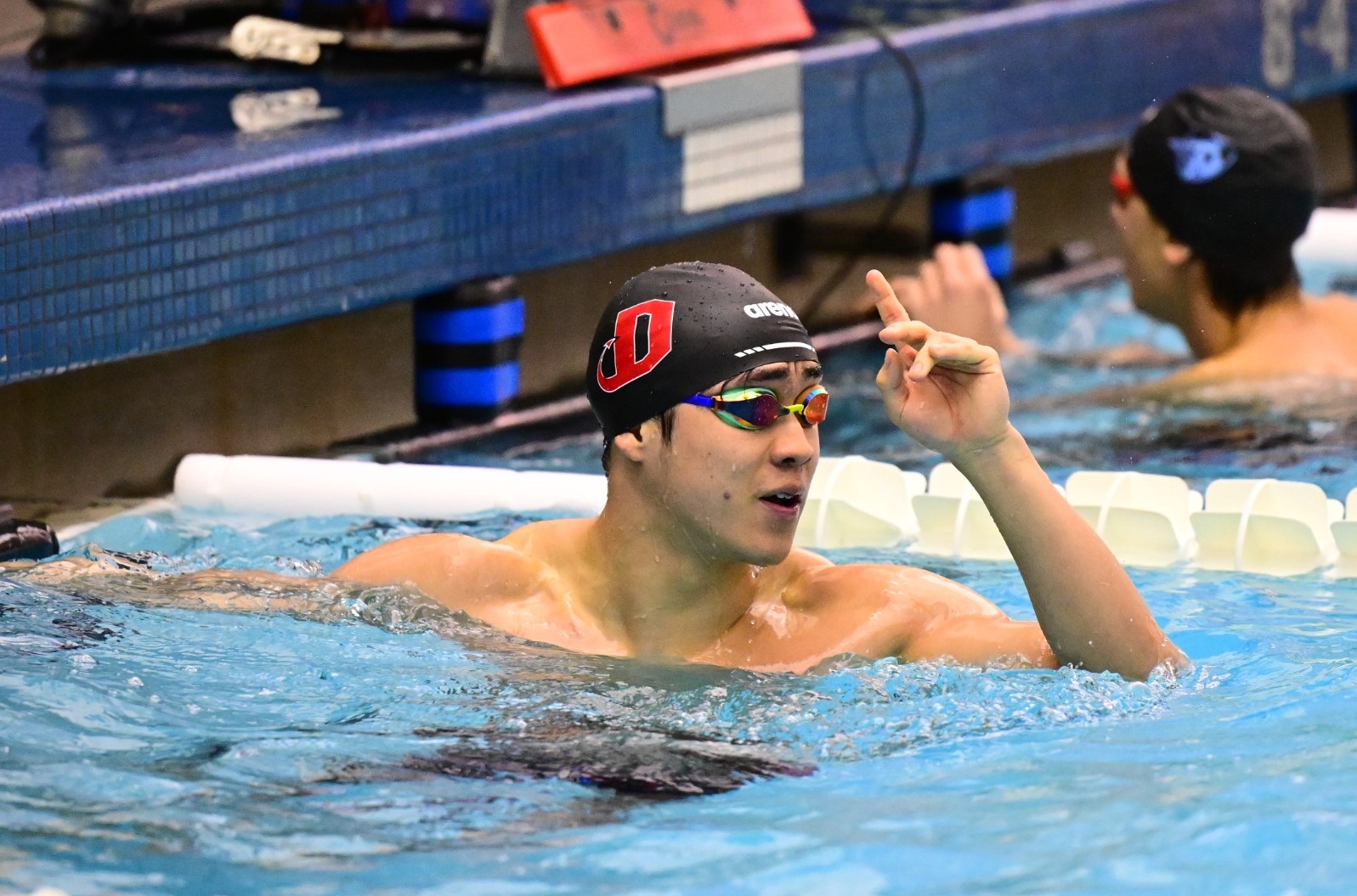 Swimmer Samson Qu celebrates a huge win