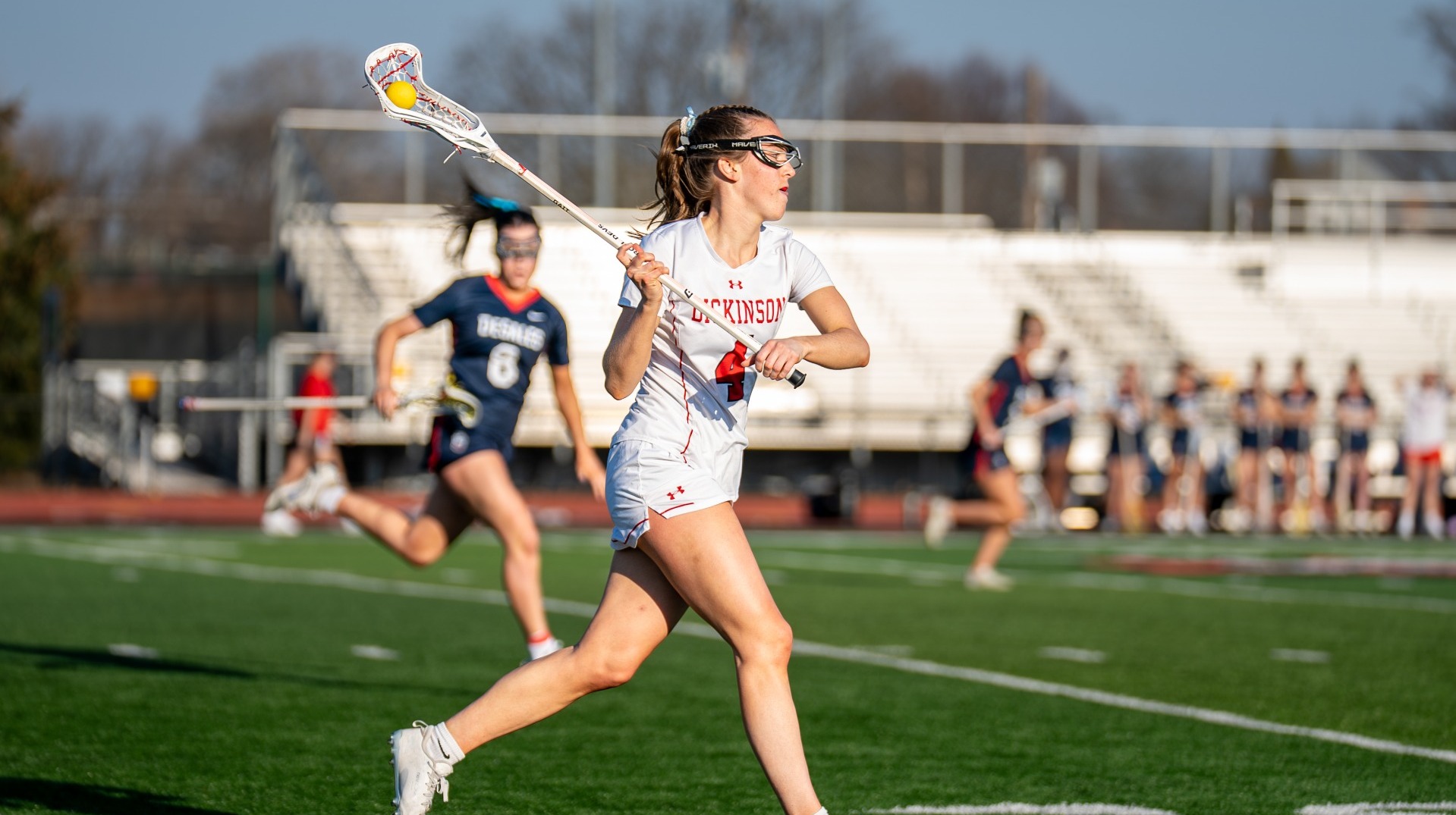 Ali Broome carrying the ball forward against DeSales University on 2-28-26