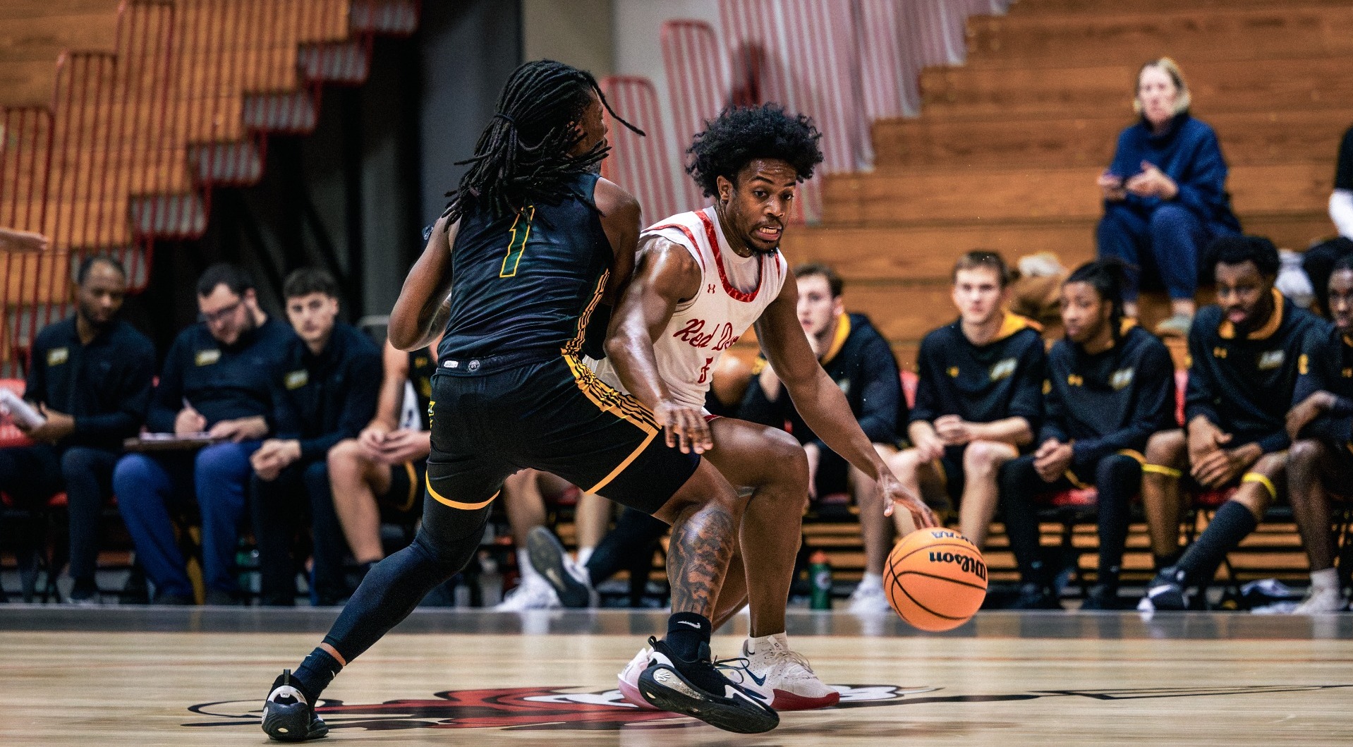 Isaiah Edmond dribbling down the left side of the lane against McDaniel College on 1-14-26