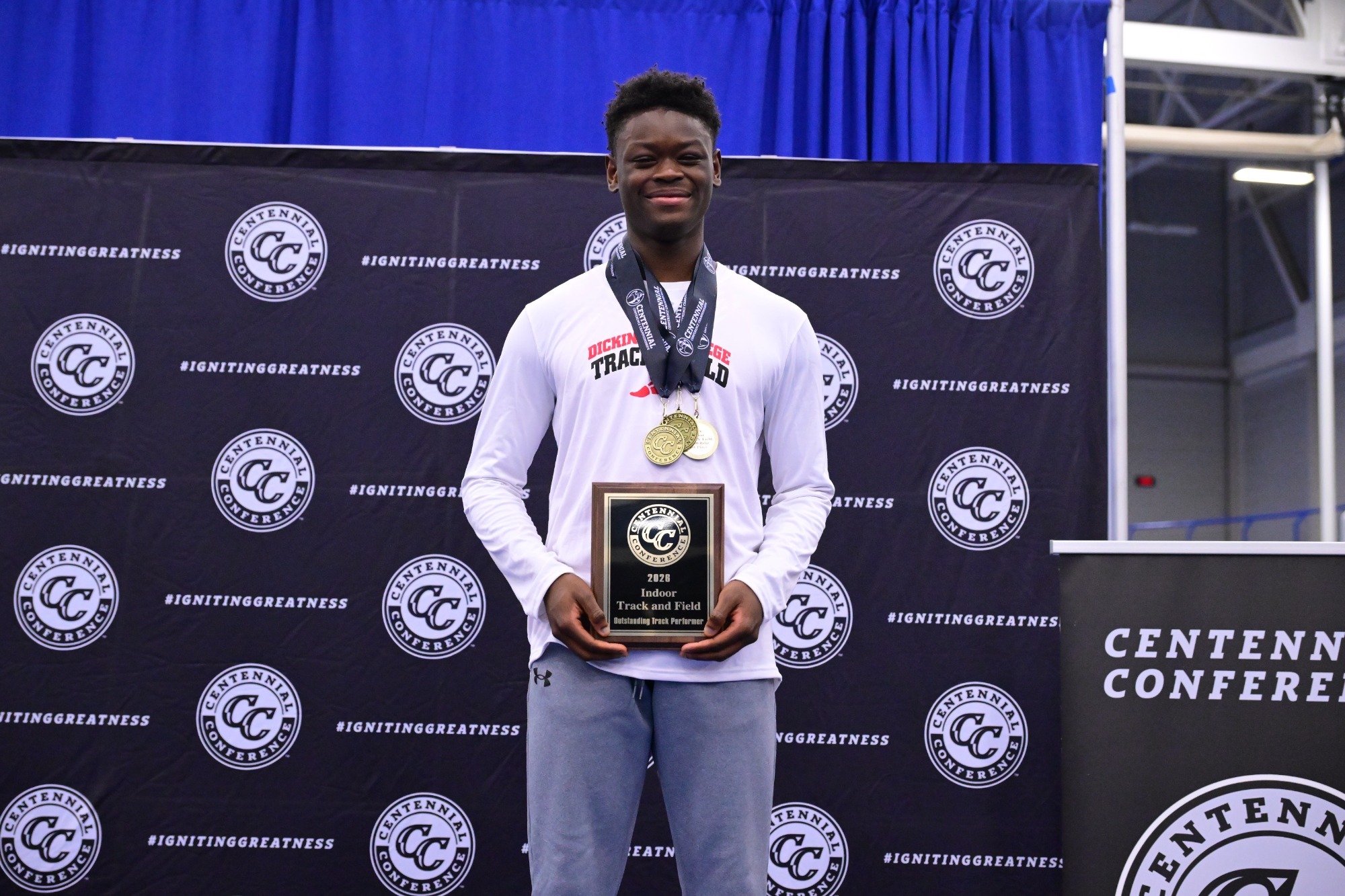 Franklyn Akabi-During poses with gold medals and 2026 Indoor Champs Performer of the Meet plaque 