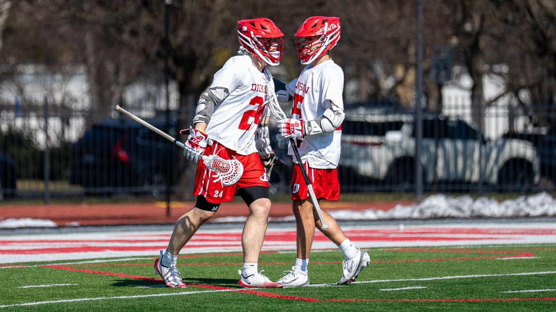 Preston Boyd and Drew Stark celebrating after scoring a goal against Roanoke College on 2-28-26
